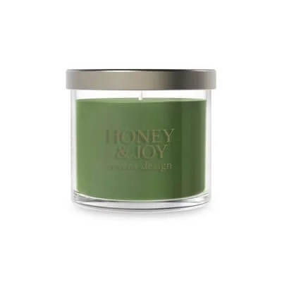 Small Yankee Candle tumbler with label and lid visible.