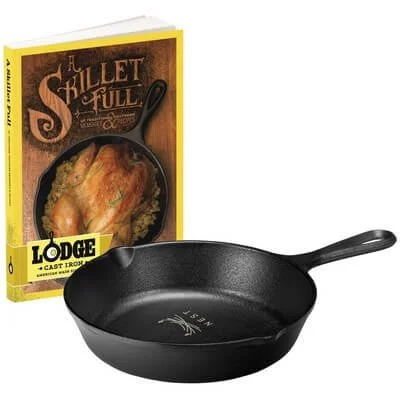 Lodge cast-iron skillet displayed beside its included cookbook.