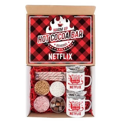 Hot cocoa kit opened to show two mugs, cocoa, and toppings.