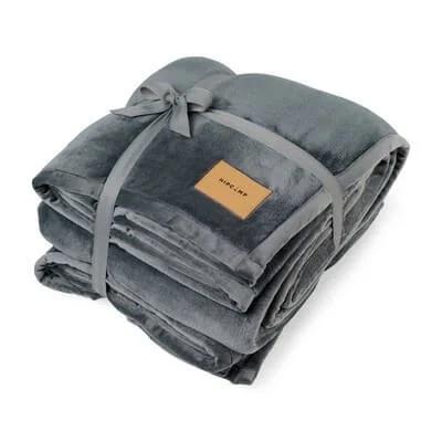 Oversized charcoal blanket spread across a sofa.