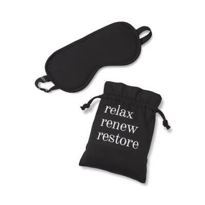 Black R&R eye mask laid flat with its strap visible.