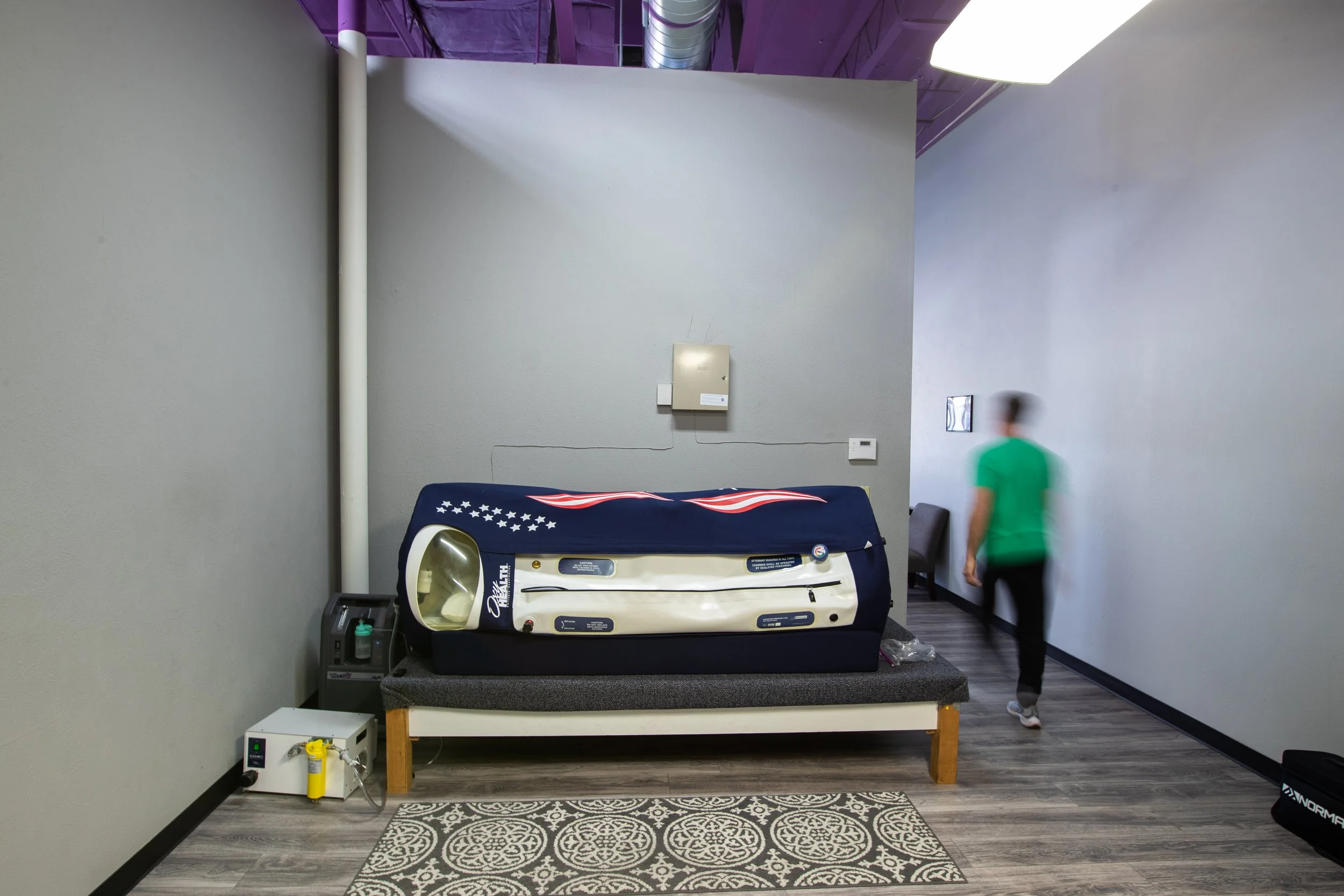 Clean, professional medical spa treatment room with neutral tones at Icelandic Fitness and Recovery in Cherry Creek