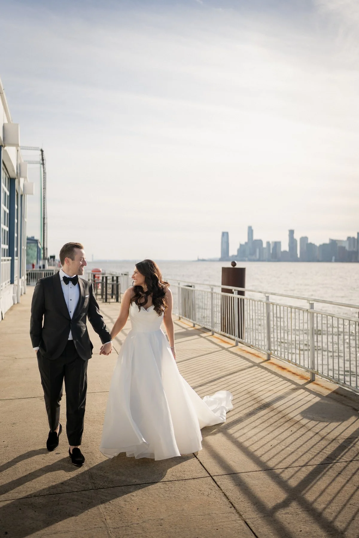 Bride and groom portrait with Hudson River views Chelsea Piers