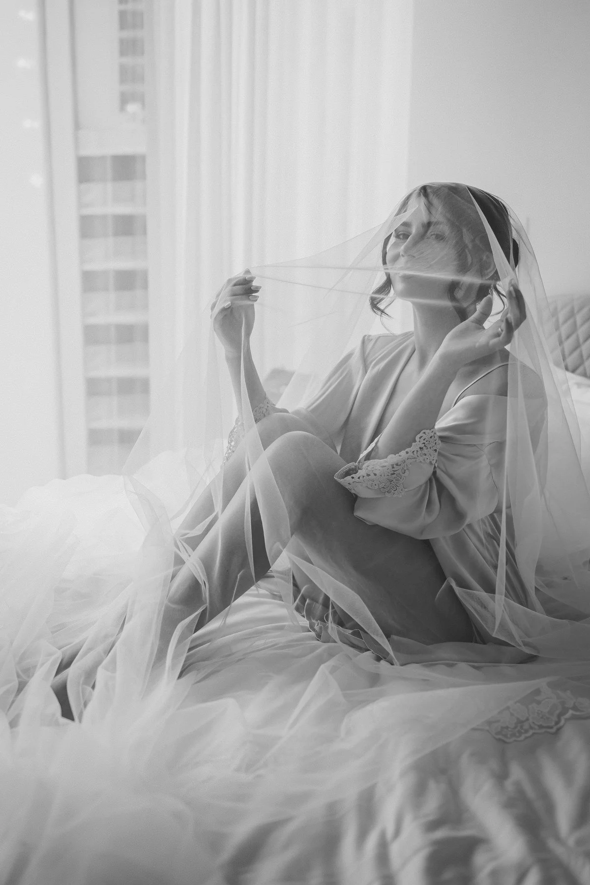 Bride with veil in suite at Virgin Hotels NYC wedding