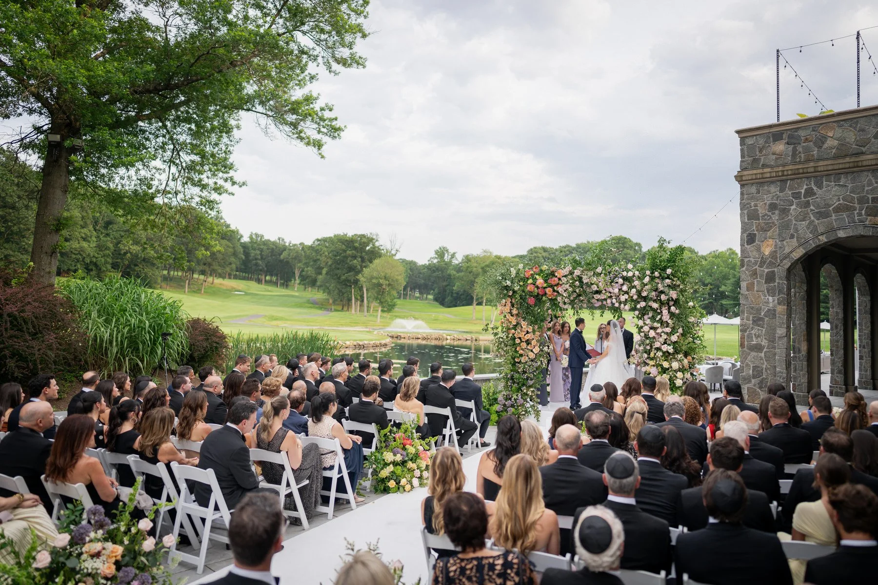 Wedding ceremony at Alpine Country Club with golf course views
