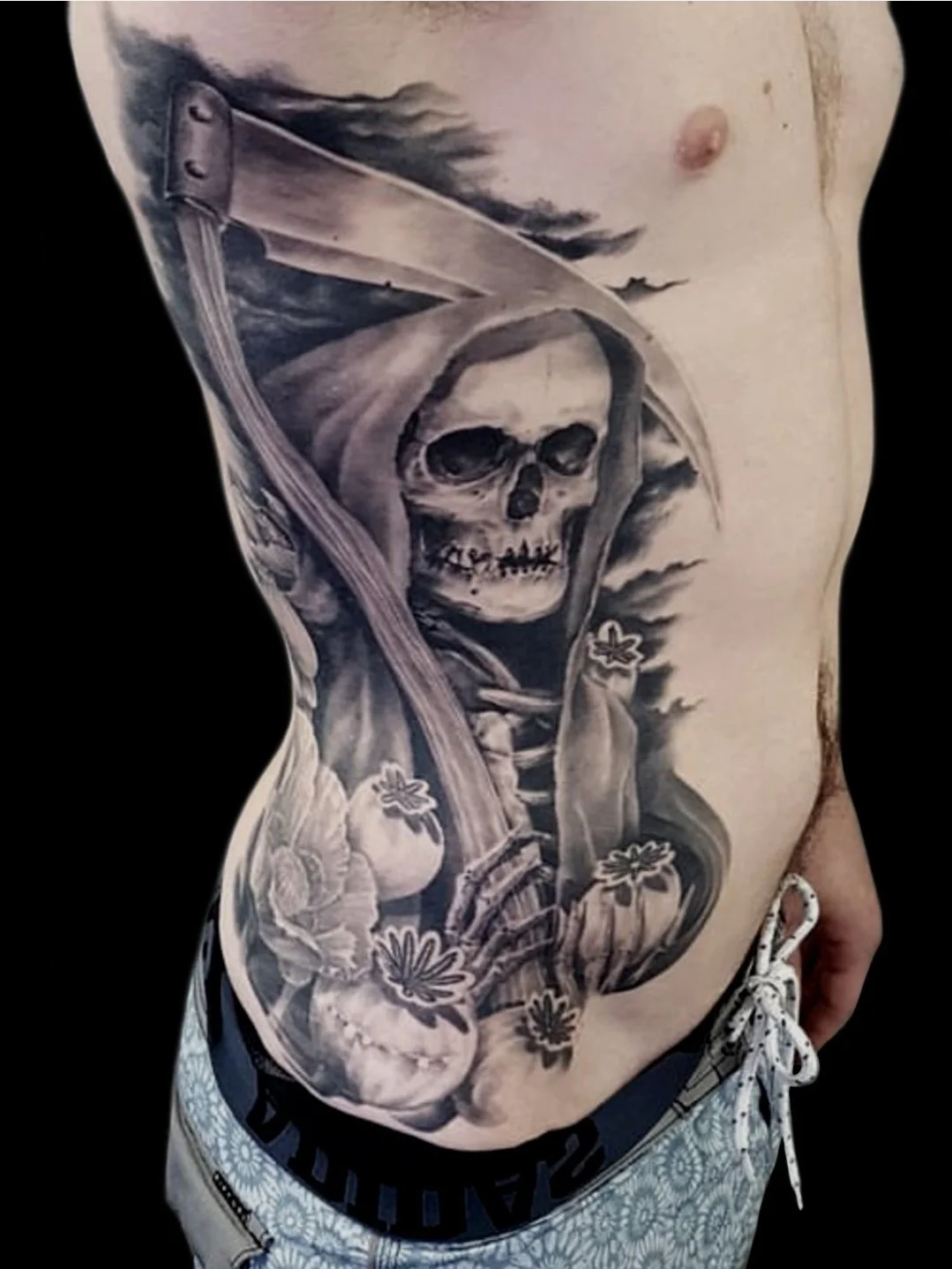 billy_sarno_huntington_beach_tattoo_black_and_gray_portrait_grim_reaper_scythe_poppy_bulbs_rib.jpg