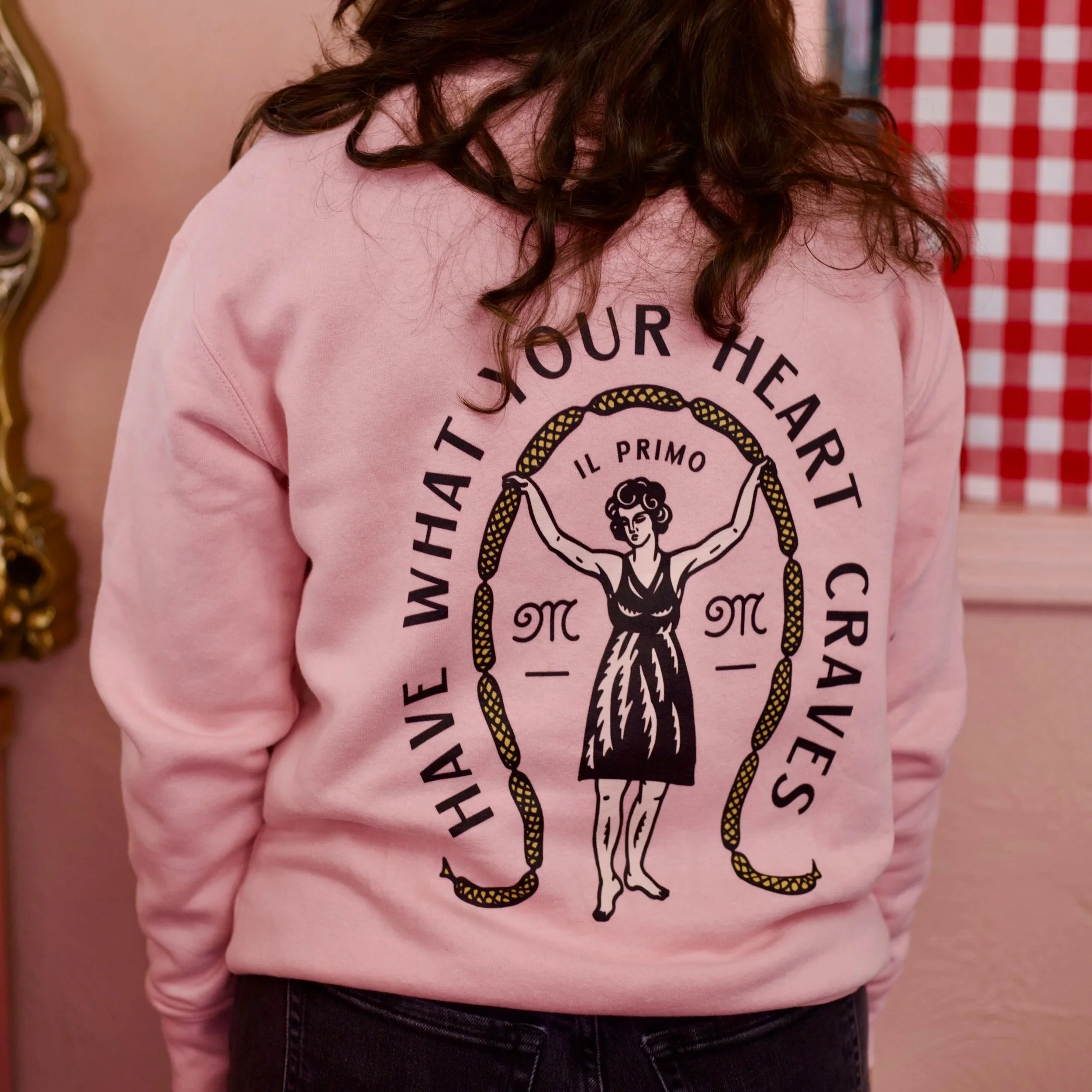 Light pink sweatshirts with vintage spoons spelling out "Mila's"