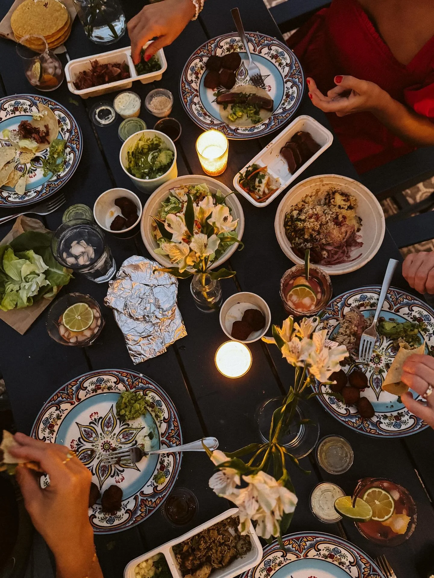 The evening kicks off with a rainbow in the sky, which feels like a sign. The ambiance: rooftop patio, light breeze, twinkle lights and whatever $5 bouquet the InstaCart shopper selected for us. We feast on four different kinds of tacos. Plantains an