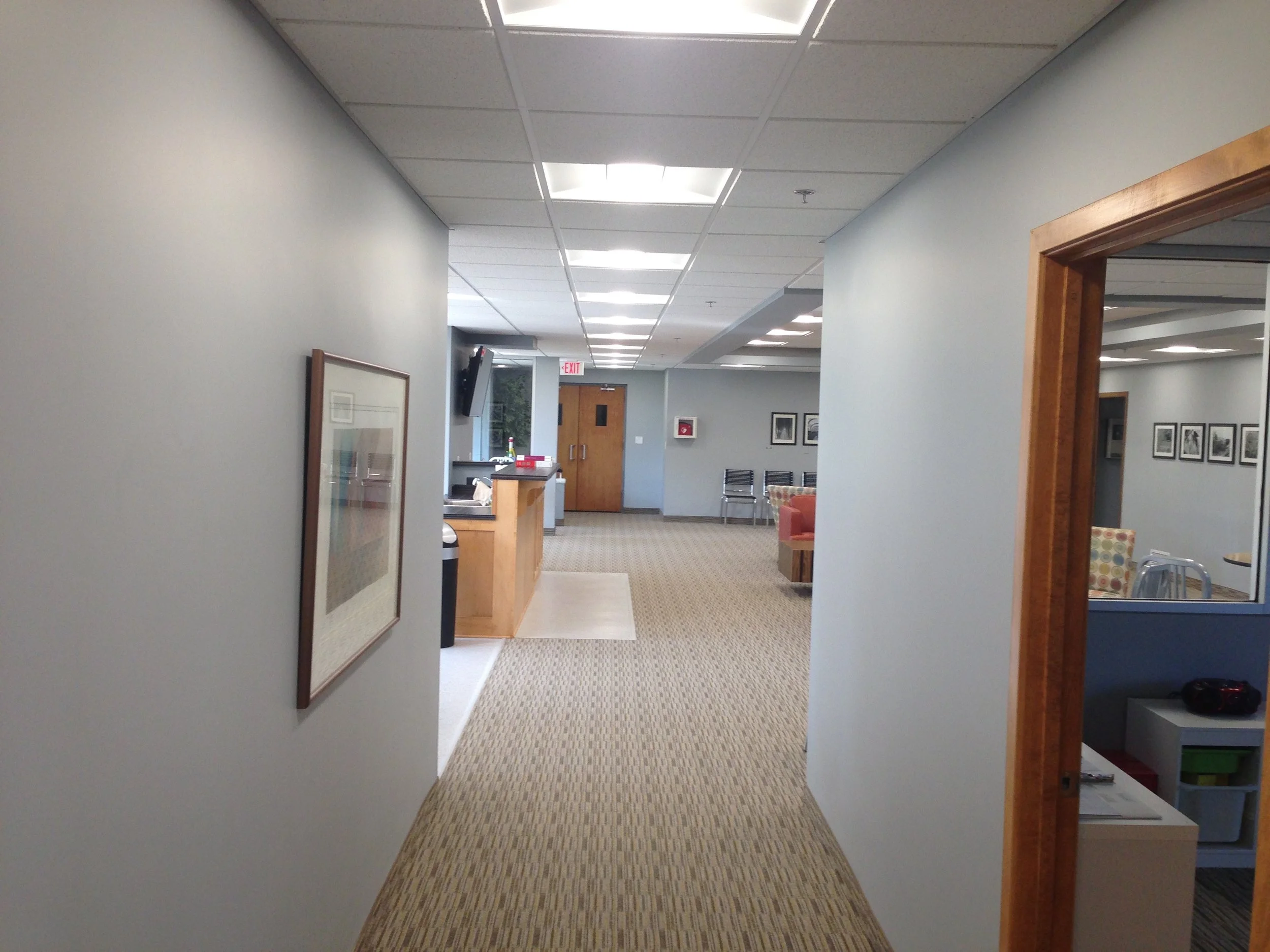 Hallway at Aldersgate Church leading to newly renovated gathering areas with updated lighting and décor.JPG
