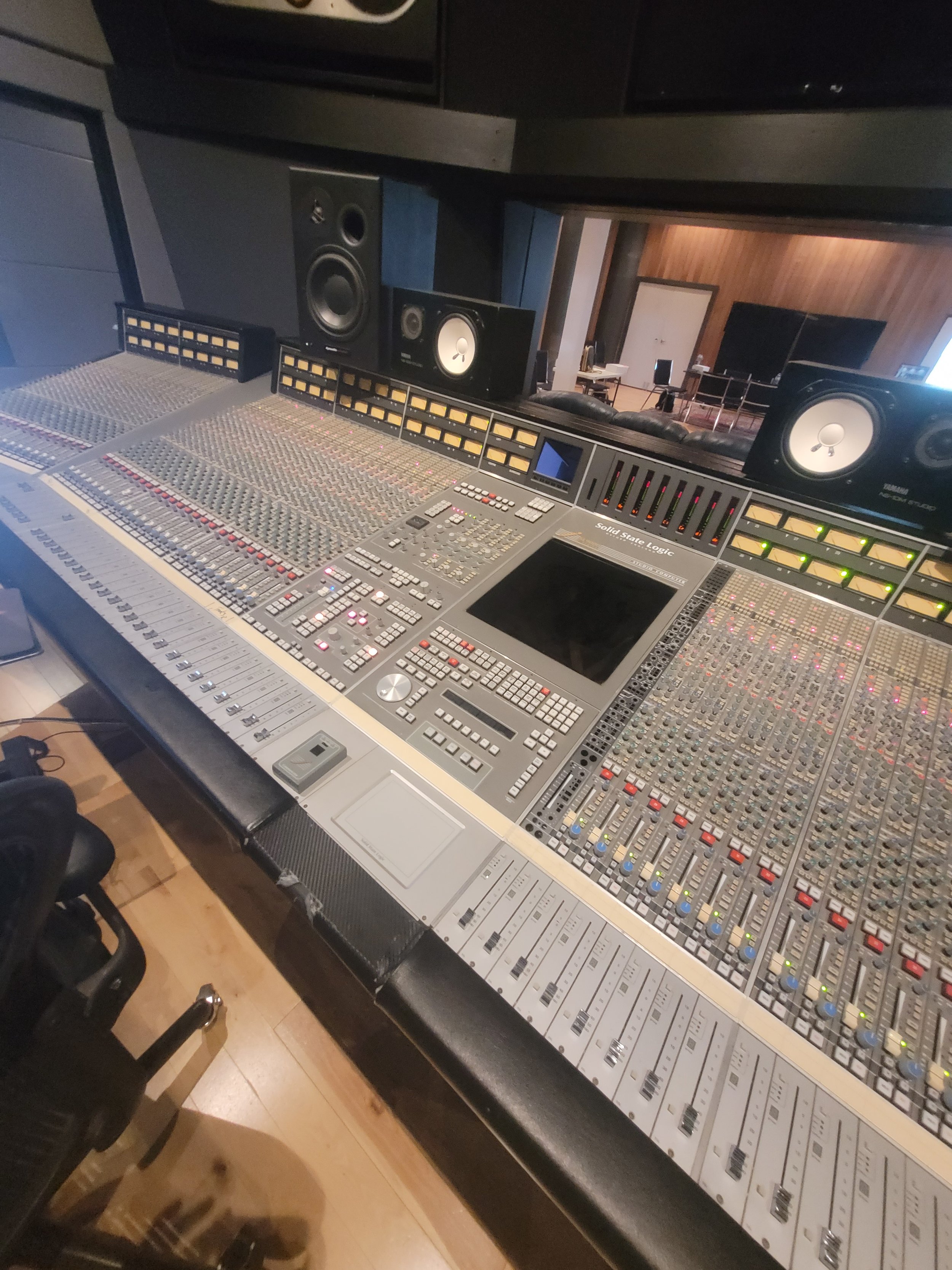photo of a equipment in the studio. speaker and audio mixer and editor equipments