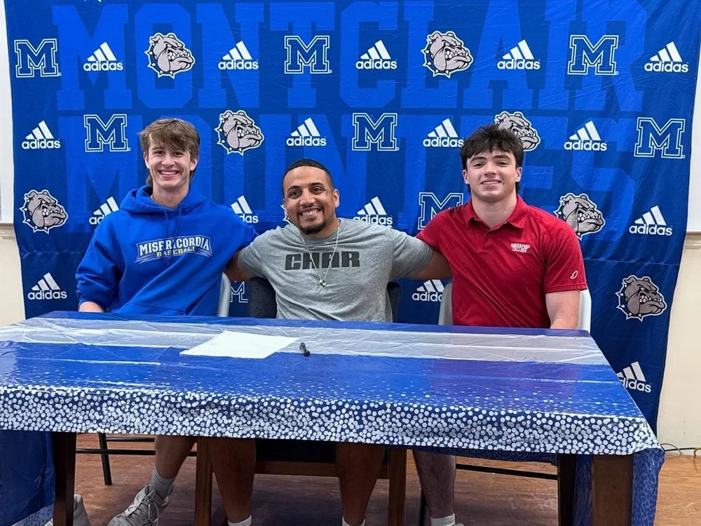 Three athletes at a signing day table, Char Sports Performance Montclair NJ