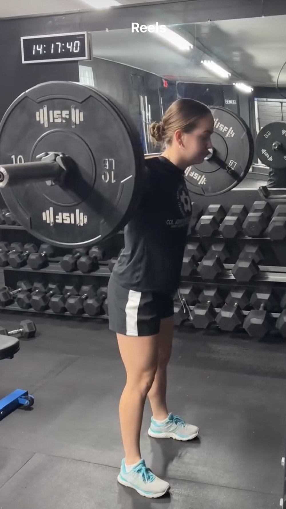 High school athlete performing a barbell back squat in the squat rack at Char Sports Performance in Montclair