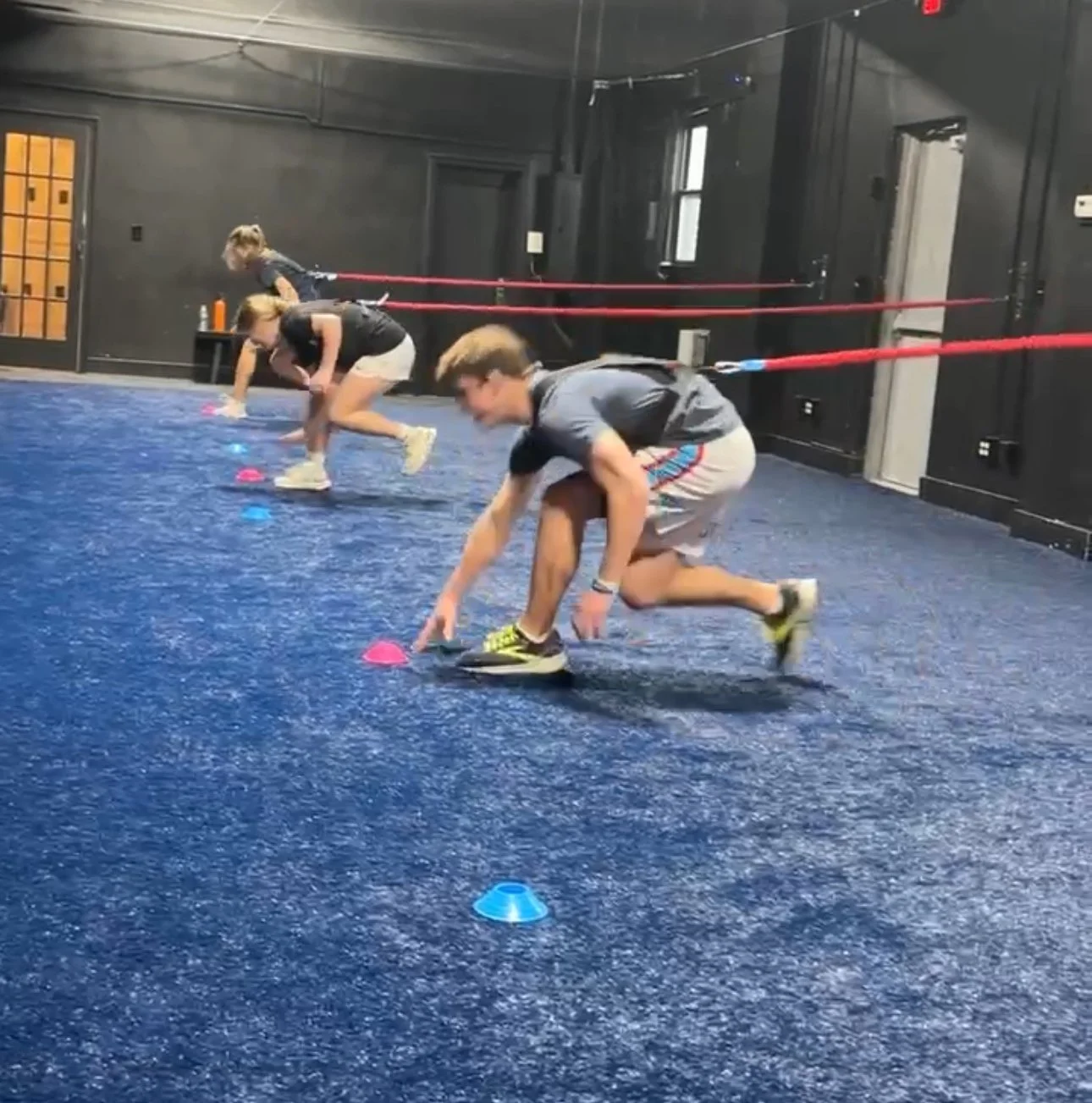 Young athletes doing agility drills on the indoor turf, Char Sports Performance Montclair NJ
