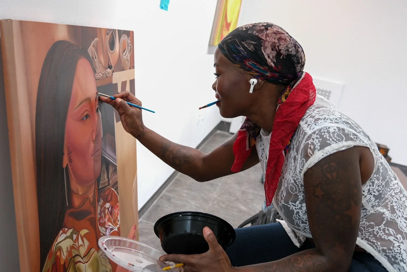 Ingrid Yuzly Mathurin painting a portrait in her New York studio.