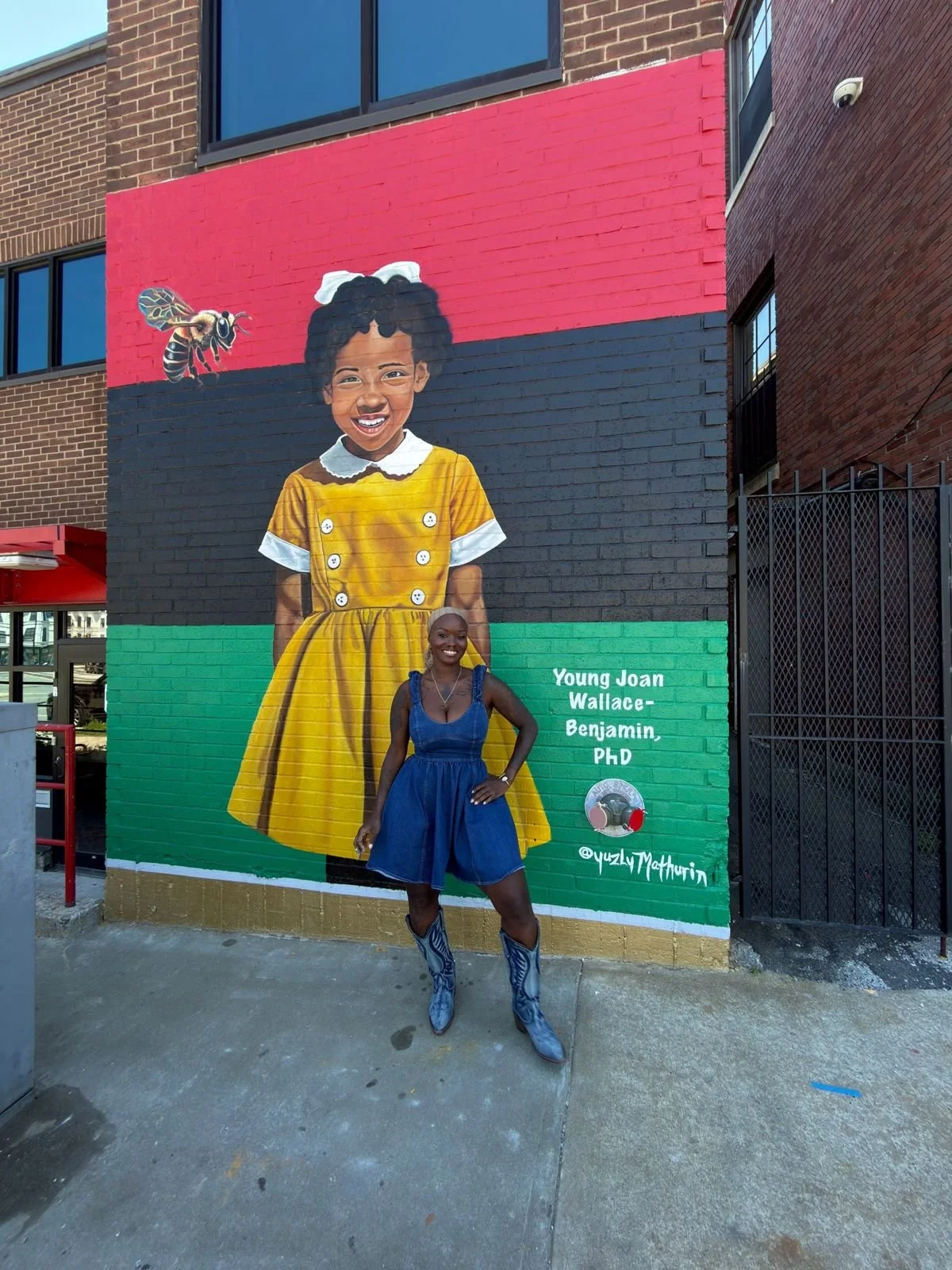 City of Boston BLKOUT Walls Mural Festival mural honoring Dr. Joan Wallace-Benjamin, painted by Haitian American muralist Ingrid Yuzly Mathurin, Boston, MA, 2026.