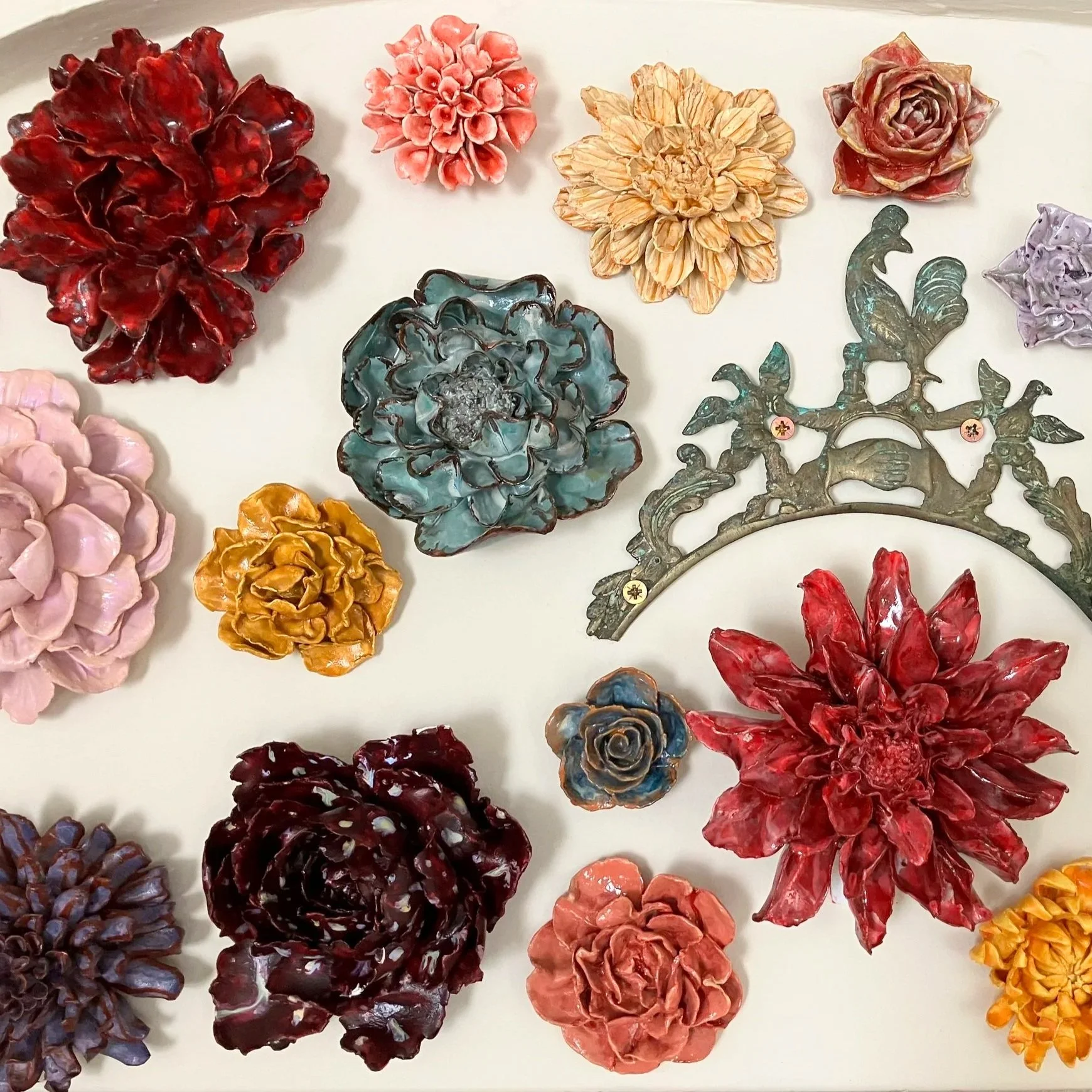 Meg Rogers, LMFT uses art on the walls, and art in session, to help clients recover from trauma and anxiety, and live lives they enjoy with neurodiversity, disability, and chronic pain. This photo is of paper flowers decorating the wall.