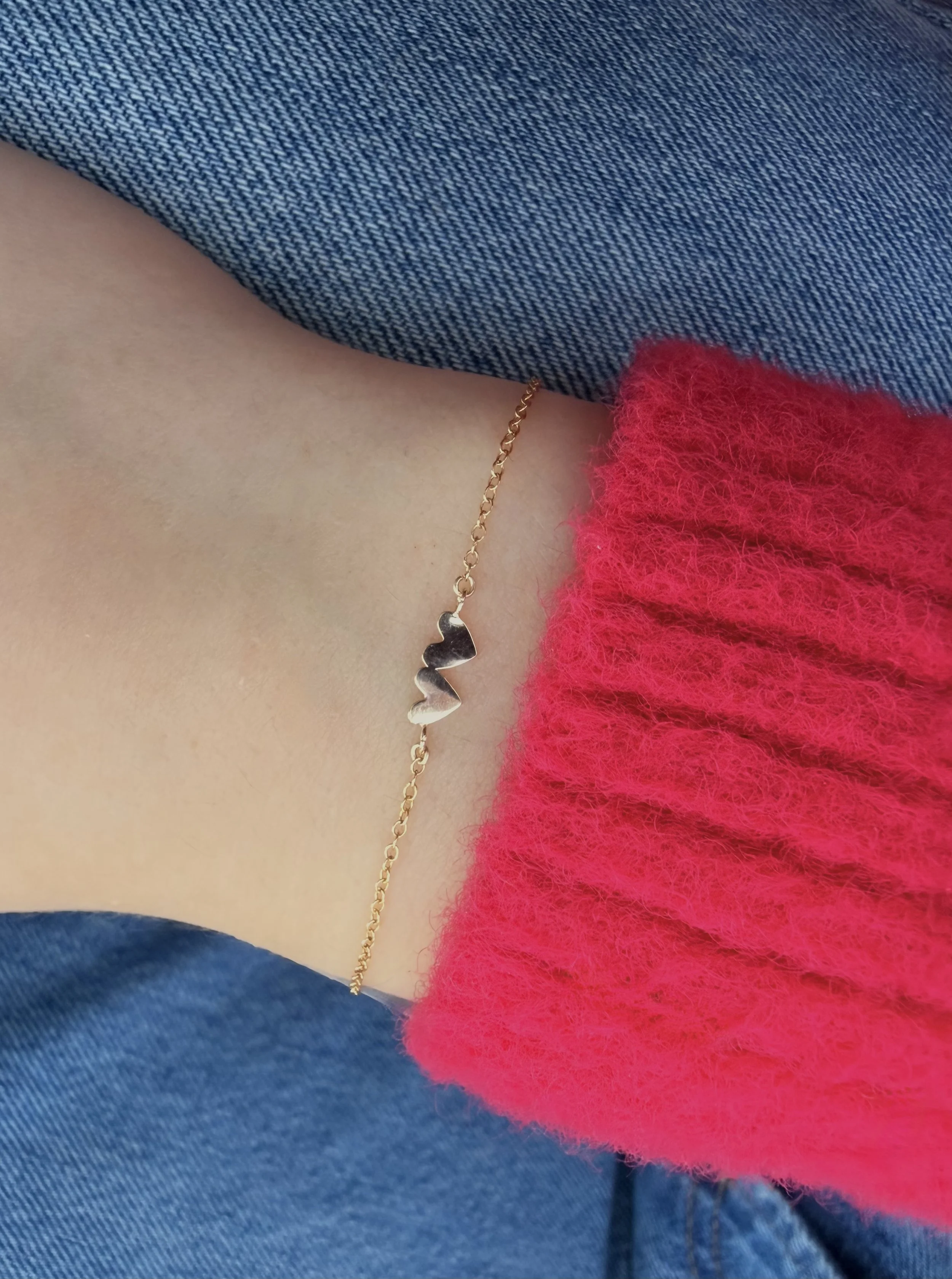 14k gold double heart bracelet layered on wrist The Sparkle Bar Edmonton