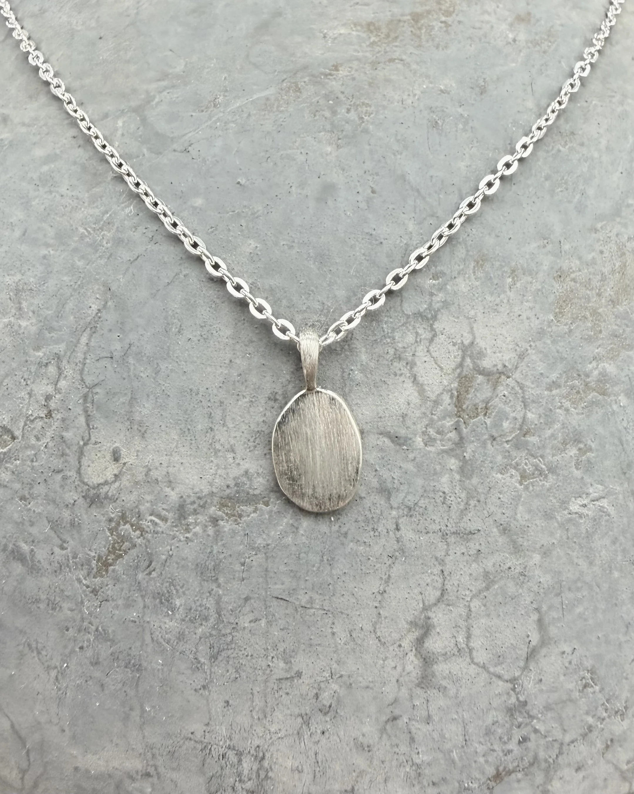 Sterling silver engravable oval charm necklace on fine chain, simple personalized jewelry