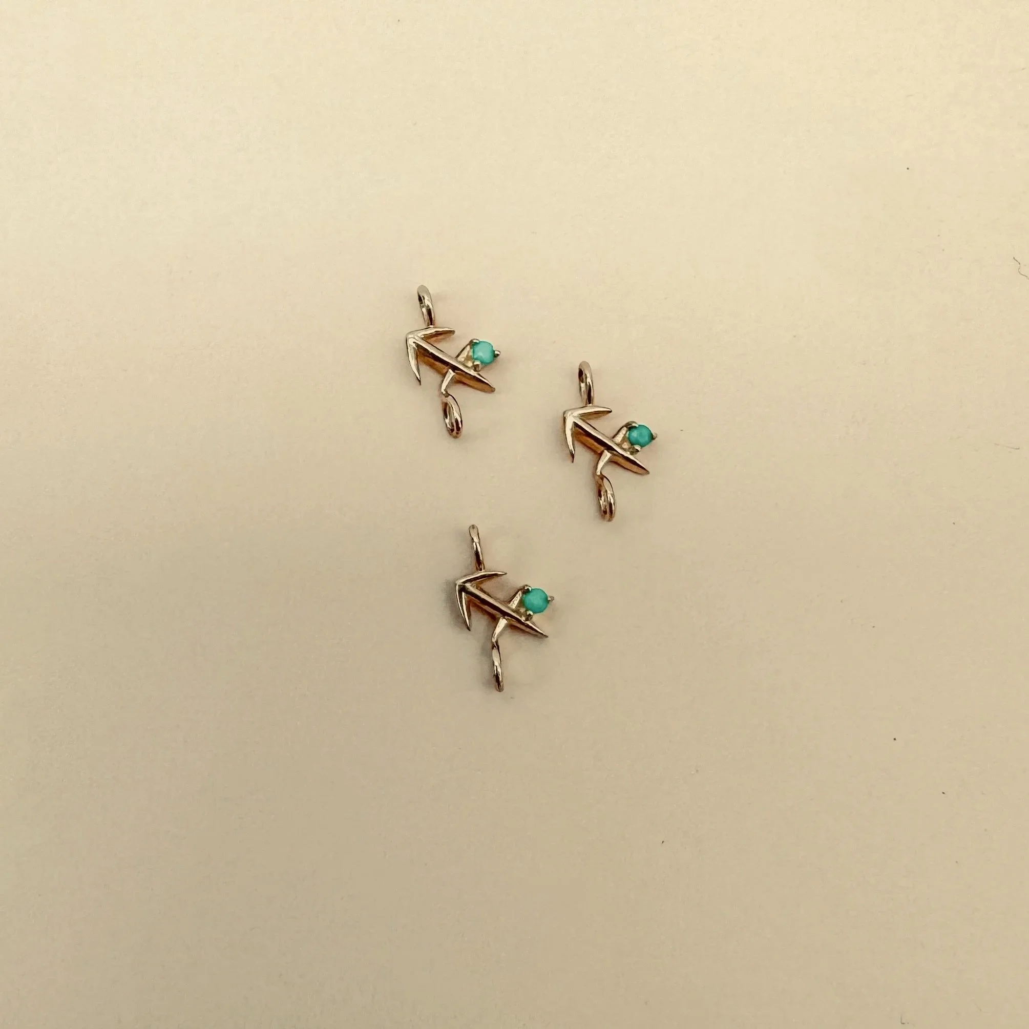 Sagittarius zodiac charm in solid 14k gold with natural turquoise birthstone. Permanent jewelry by The Sparkle Bar, Edmonton. Shop zodiac connectors online