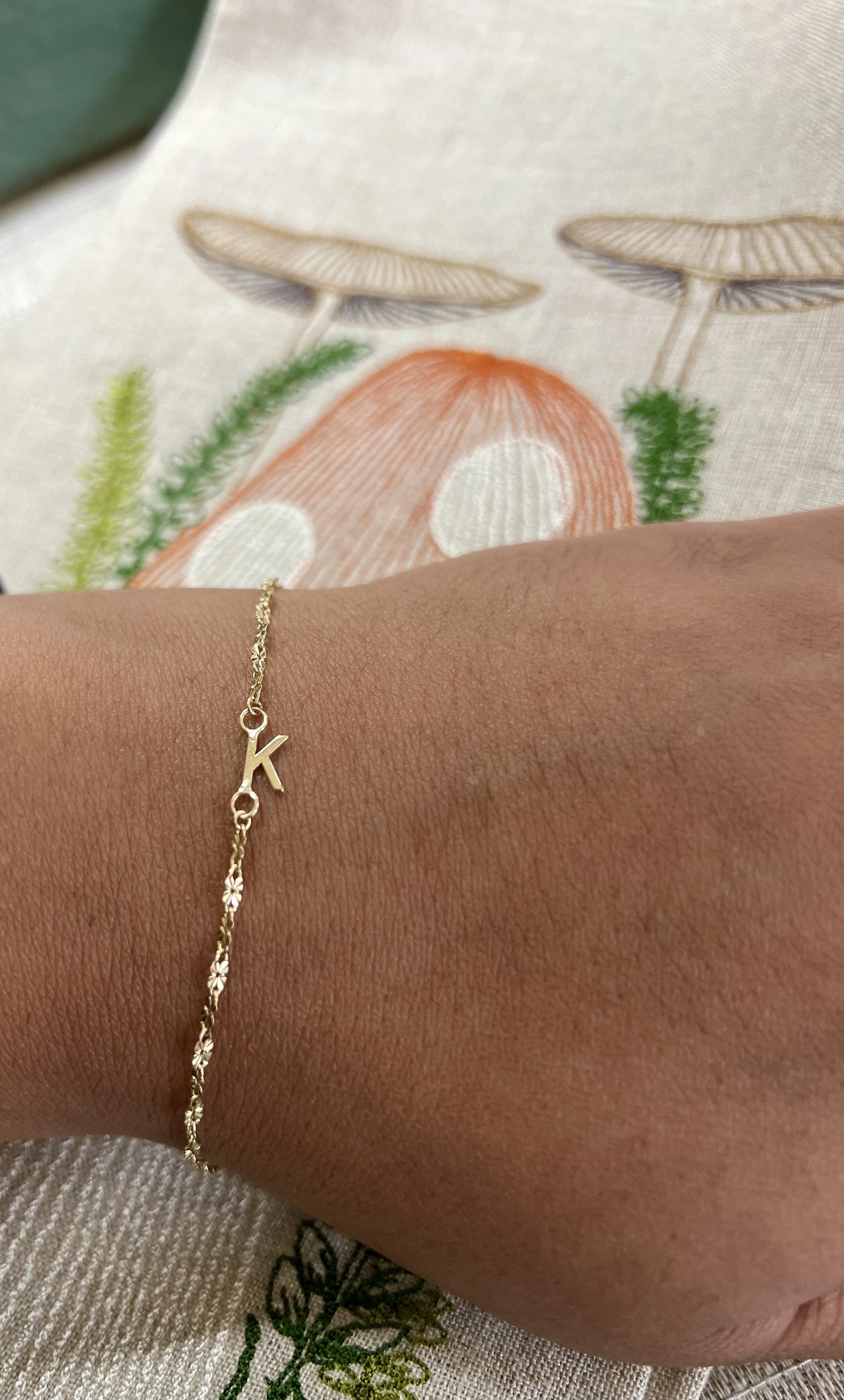 solid 14k gold initial connect on permanent bracelet.jpeg