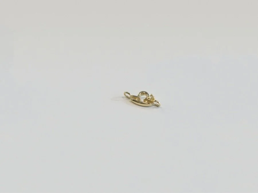 Libra zodiac connector in solid 14k gold with natural peridot gemstone from The Sparkle Bar. Fine jewelry handcrafted in Edmonton Canada.