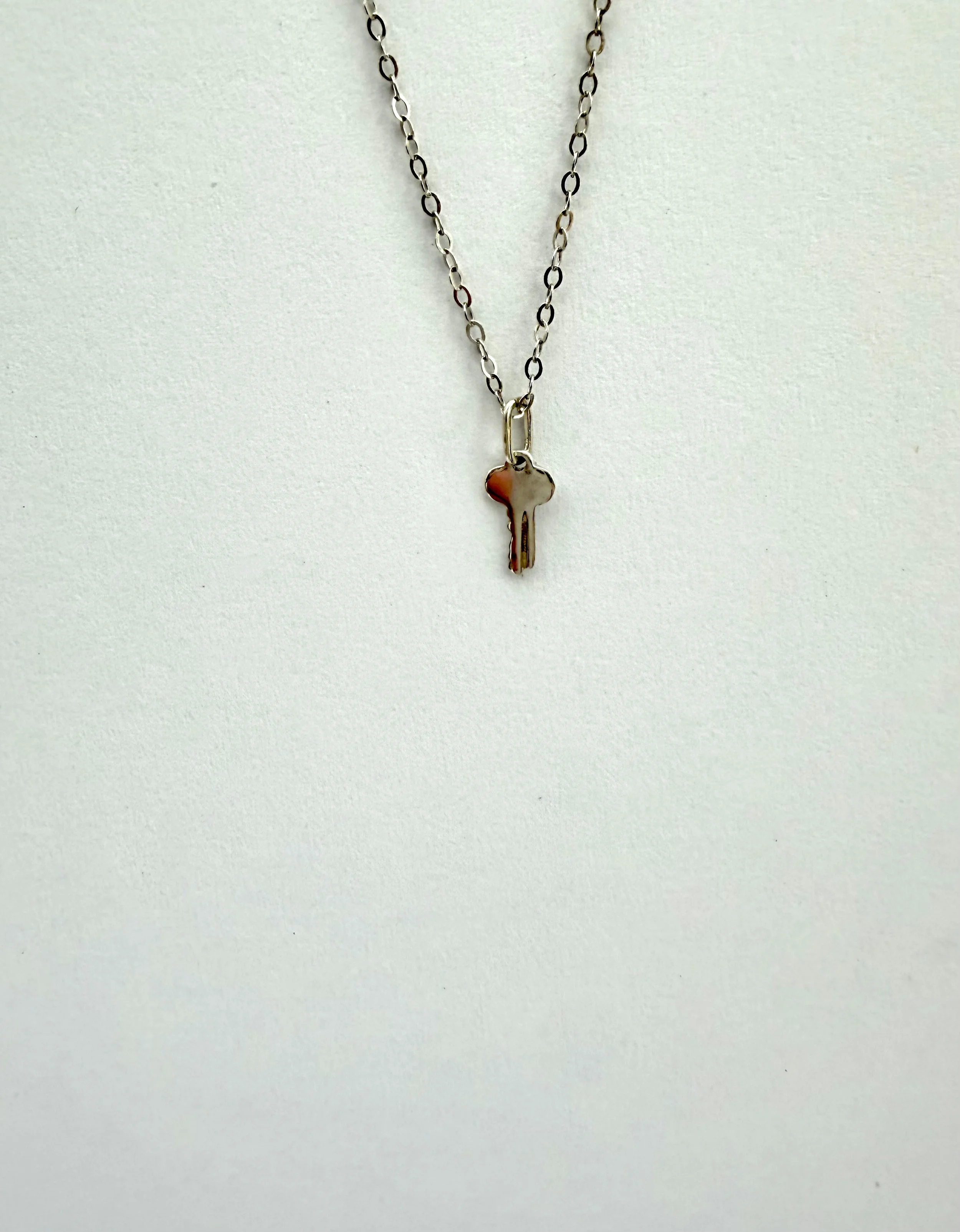 Sterling silver engravable key charm necklace on fine chain, delicate symbolic jewelry