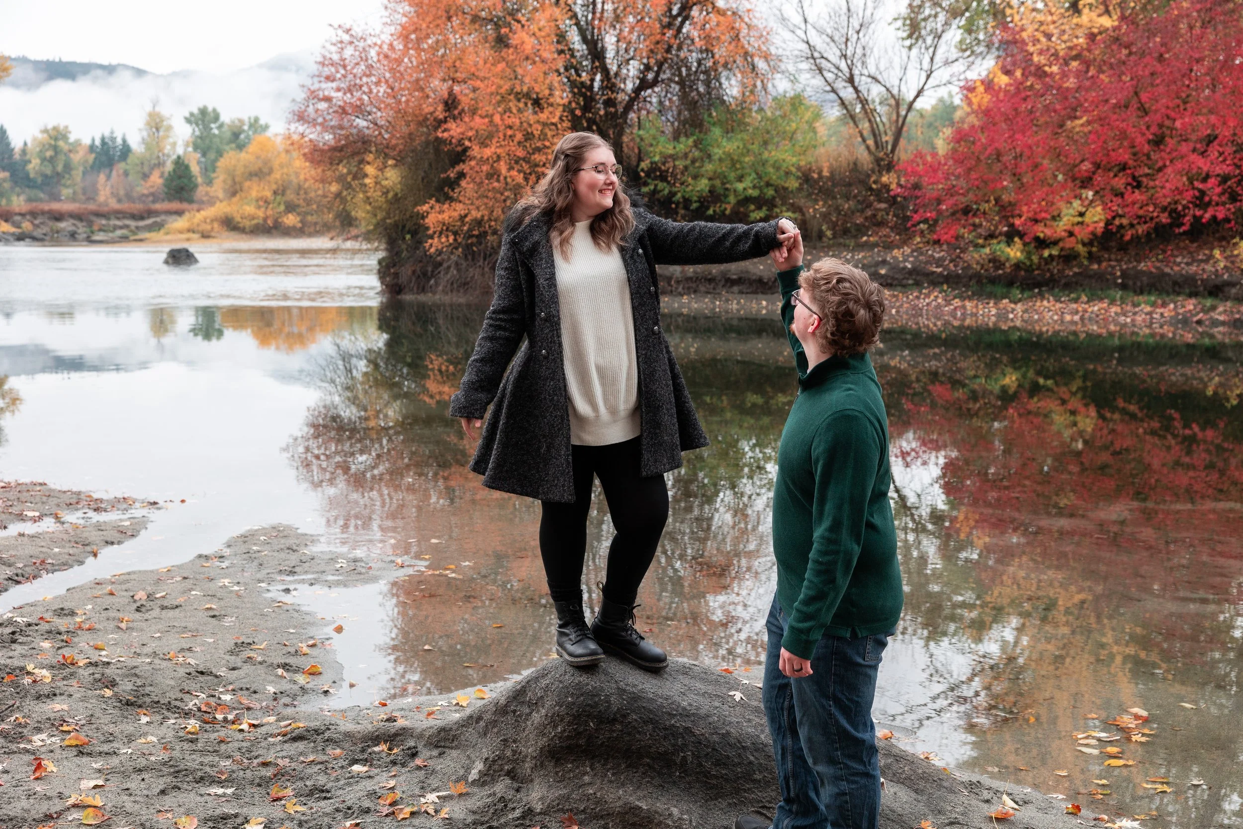 Engaged couple posing for fall photos in Leavenworth, Washington