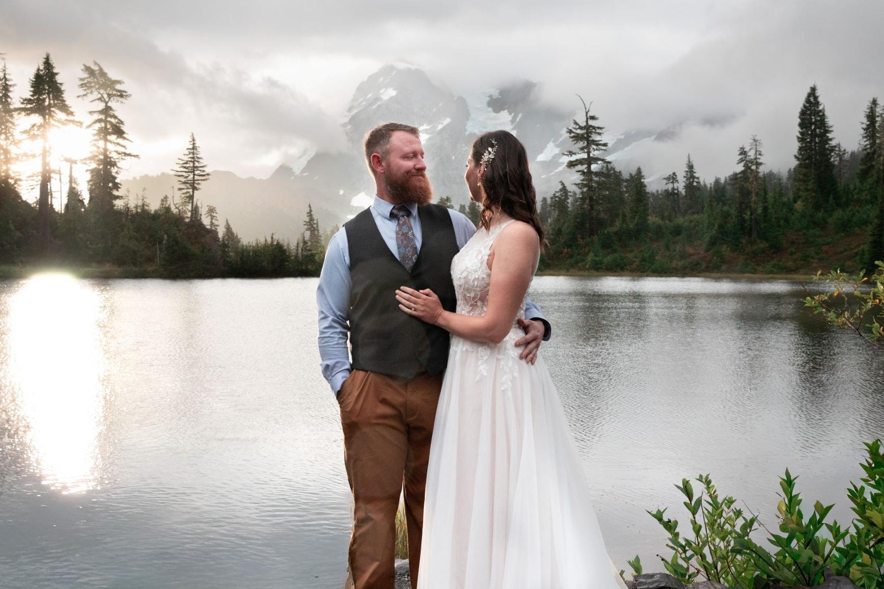 Mount Baker micro-wedding at Lake couple looking and holding each other