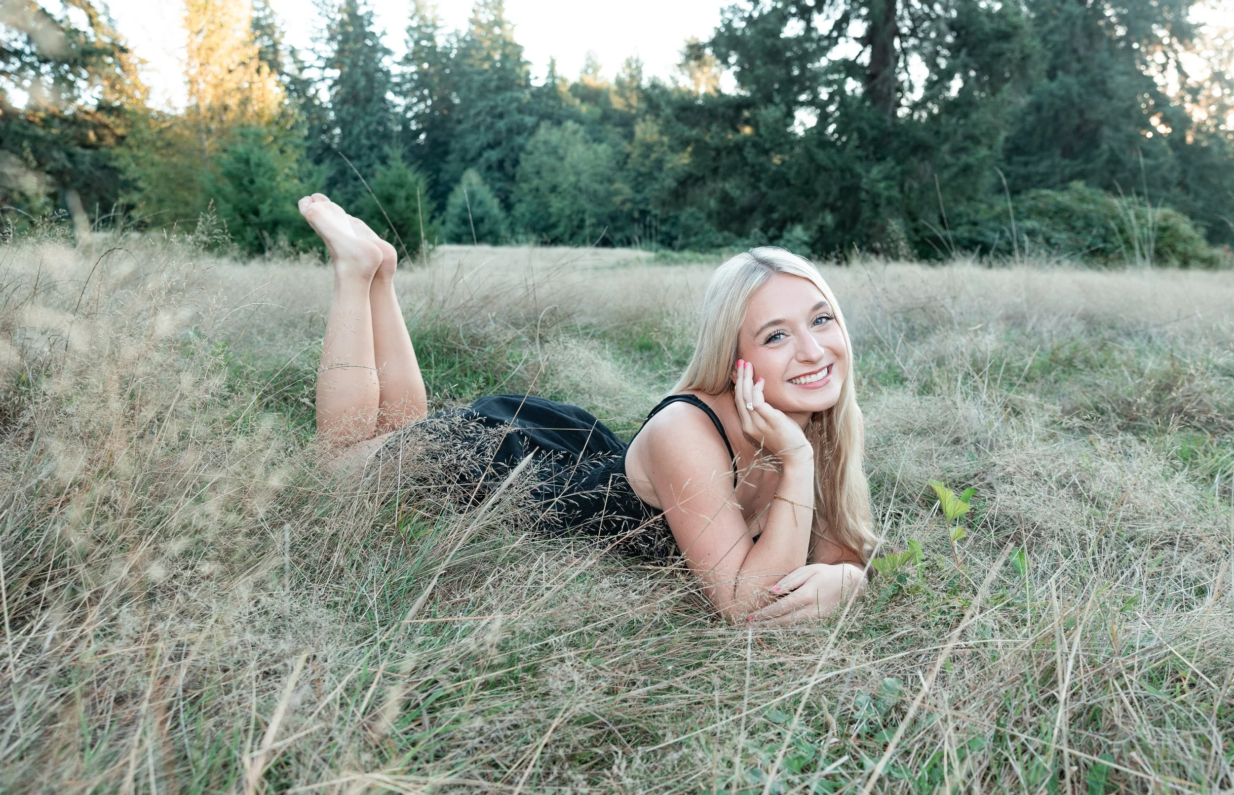 Washington senior girl in a field at golden hour, photographed by a best-rated senior photographer