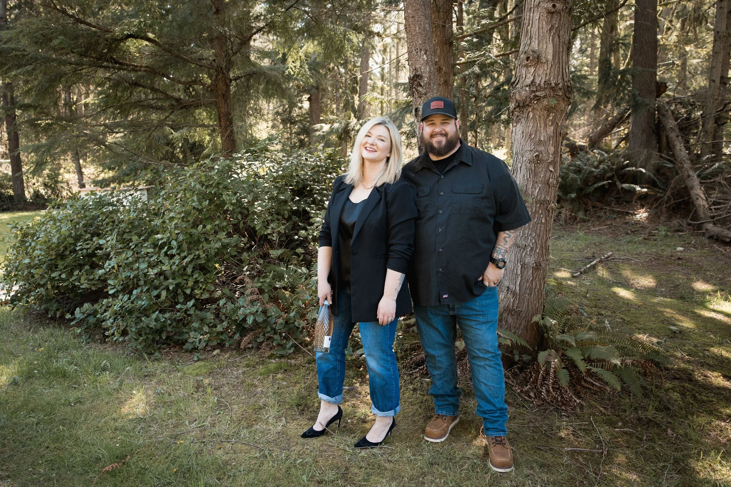 Outdoor Photoshoot of wedding vendor couple the woods for business branding in Snohomish