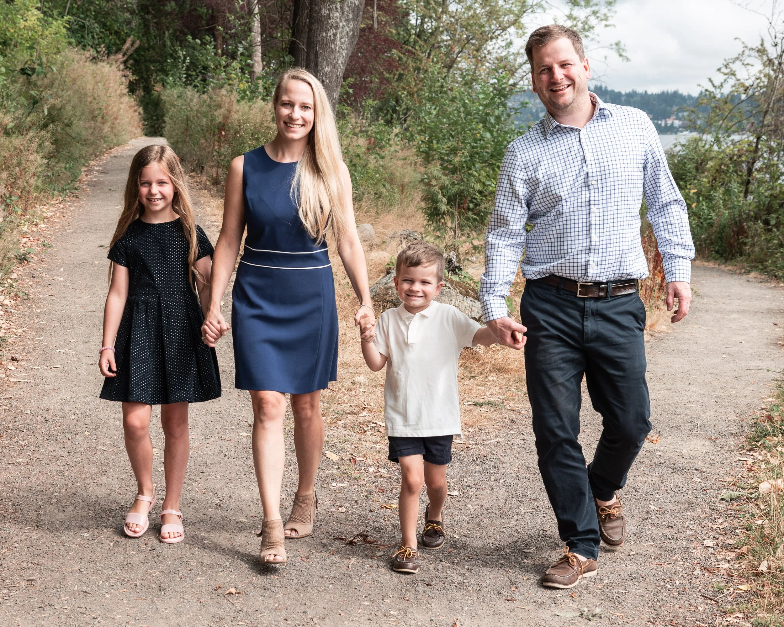 Best Kirkland Family photos at Lake Washington, family walking and holding hands smiling