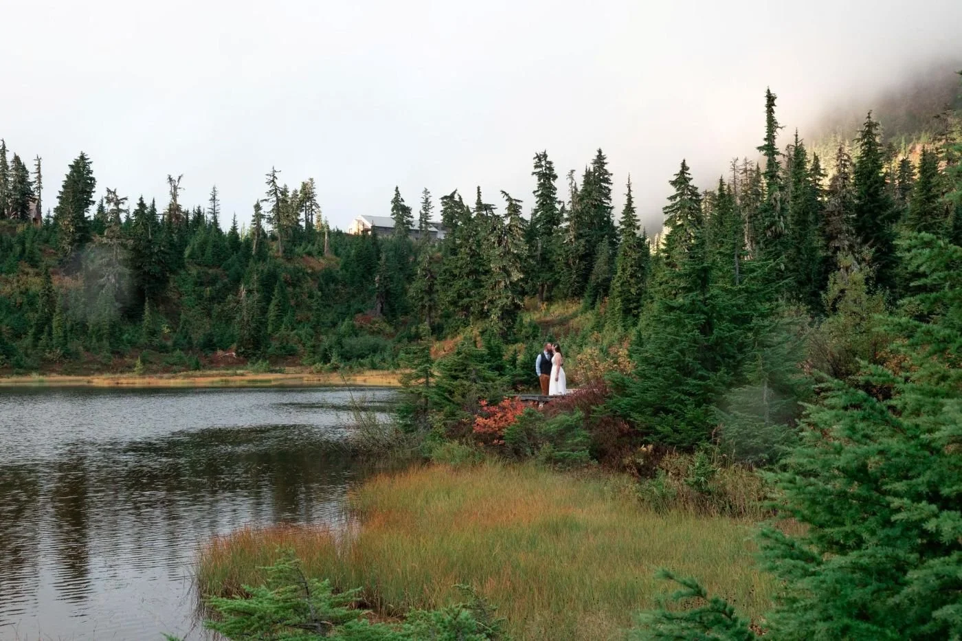 Micro-wedding at Mount Baker , couple kissing in the vast landscape