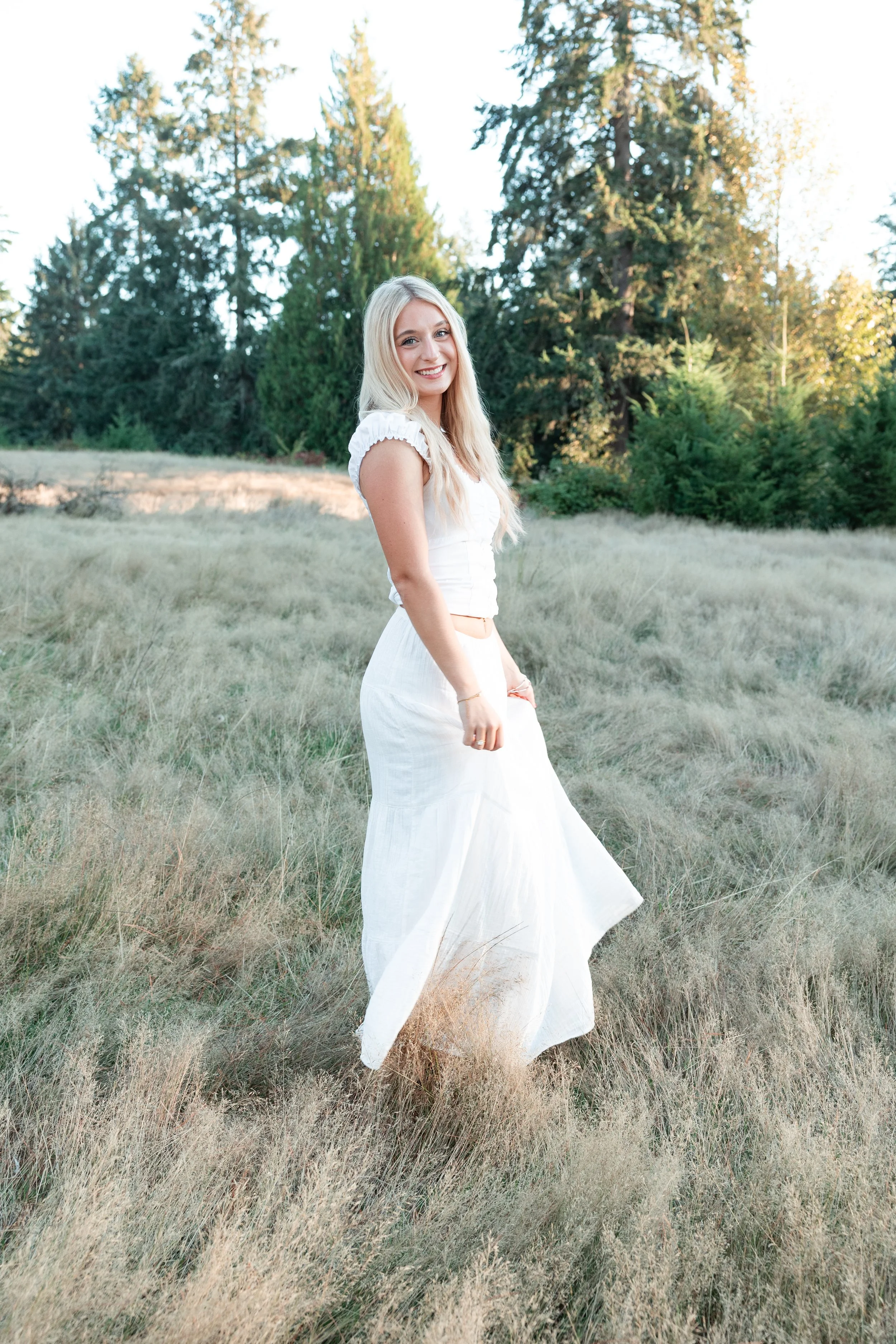Lake Stevens, Washington senior girl in a field at golden hour, photographed by a best-rated senior photographer