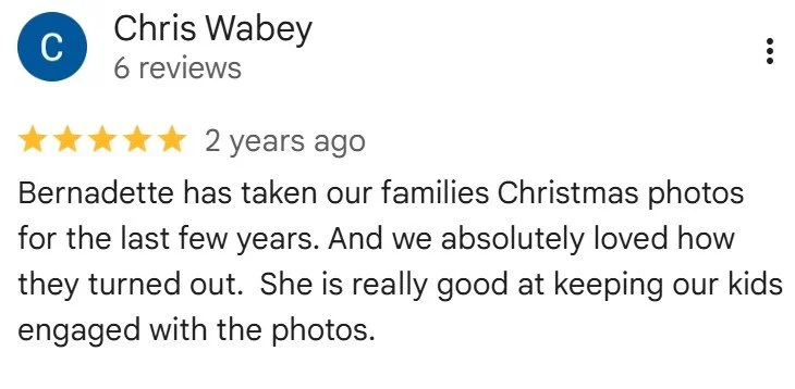 Screenshot of a 5-star review for a photographer named Chris Wabey, mentioning Bernadette and her skill at engaging kids during family Christmas photos.