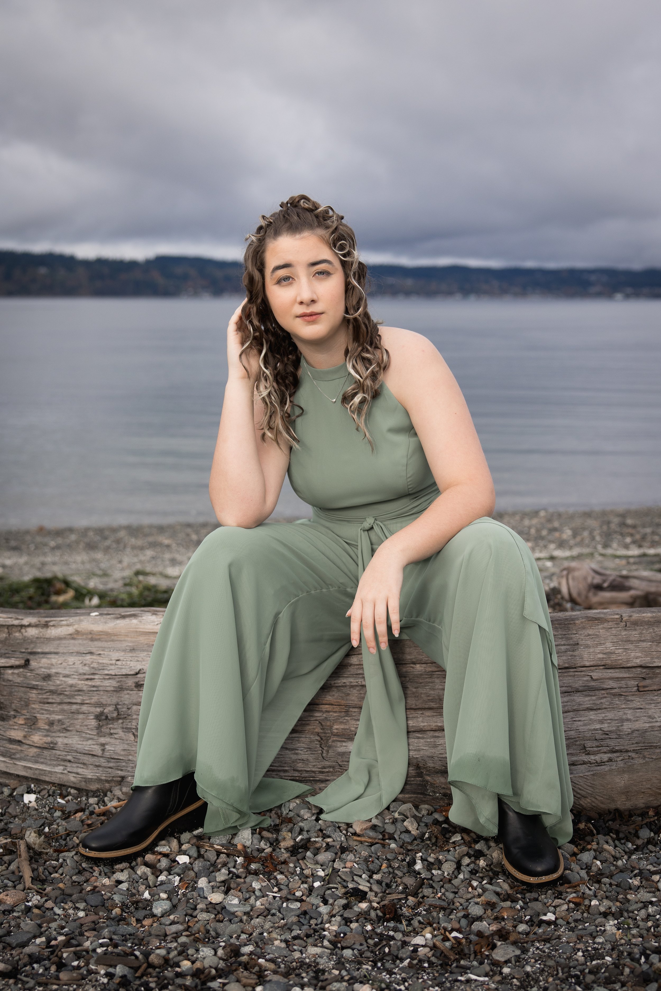 Mukilteo High School portrait at Mukilteo beach on a log with moody background