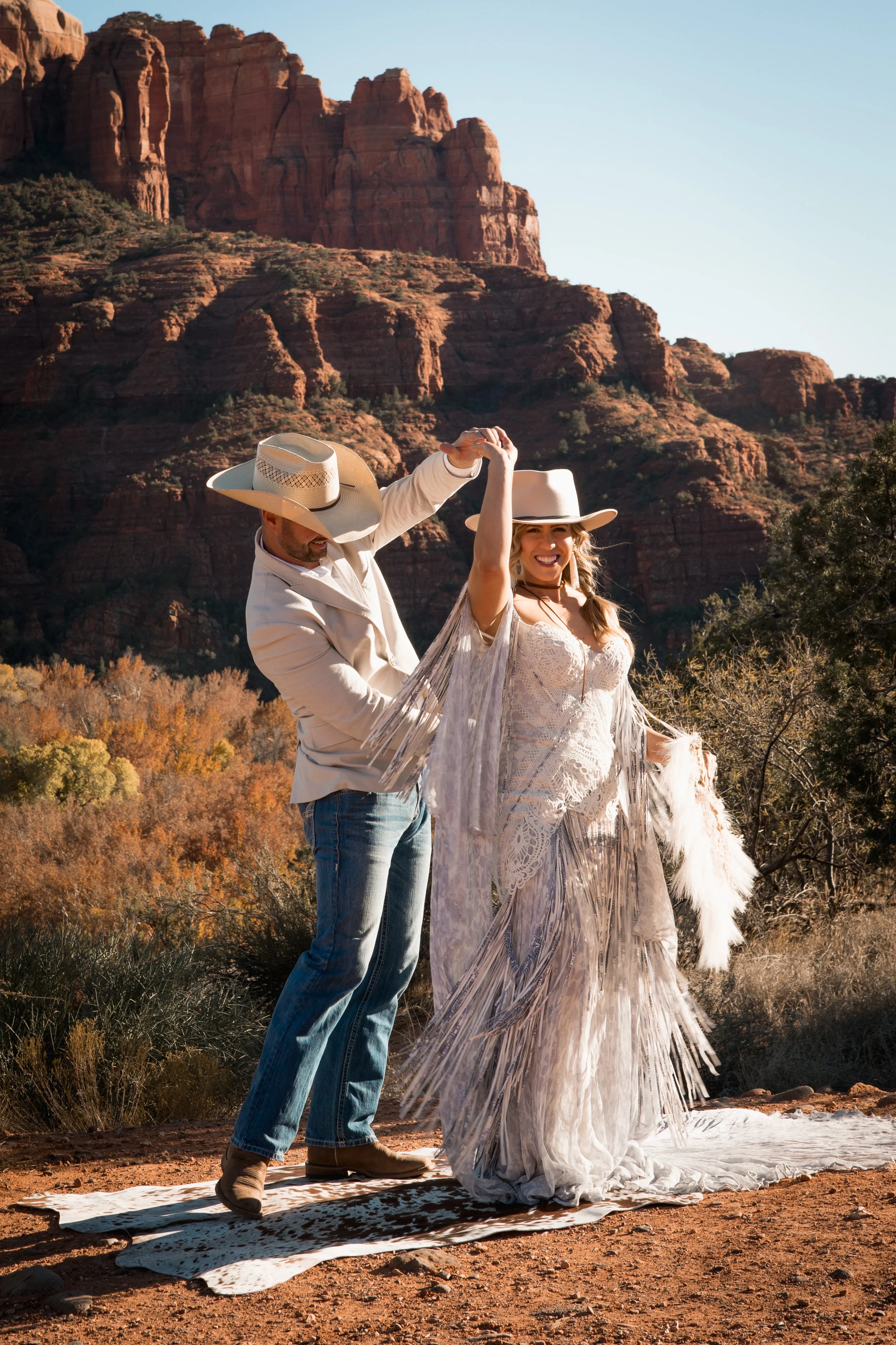 Elopement location in Sedona, couple dancing in the dessert after ceremony