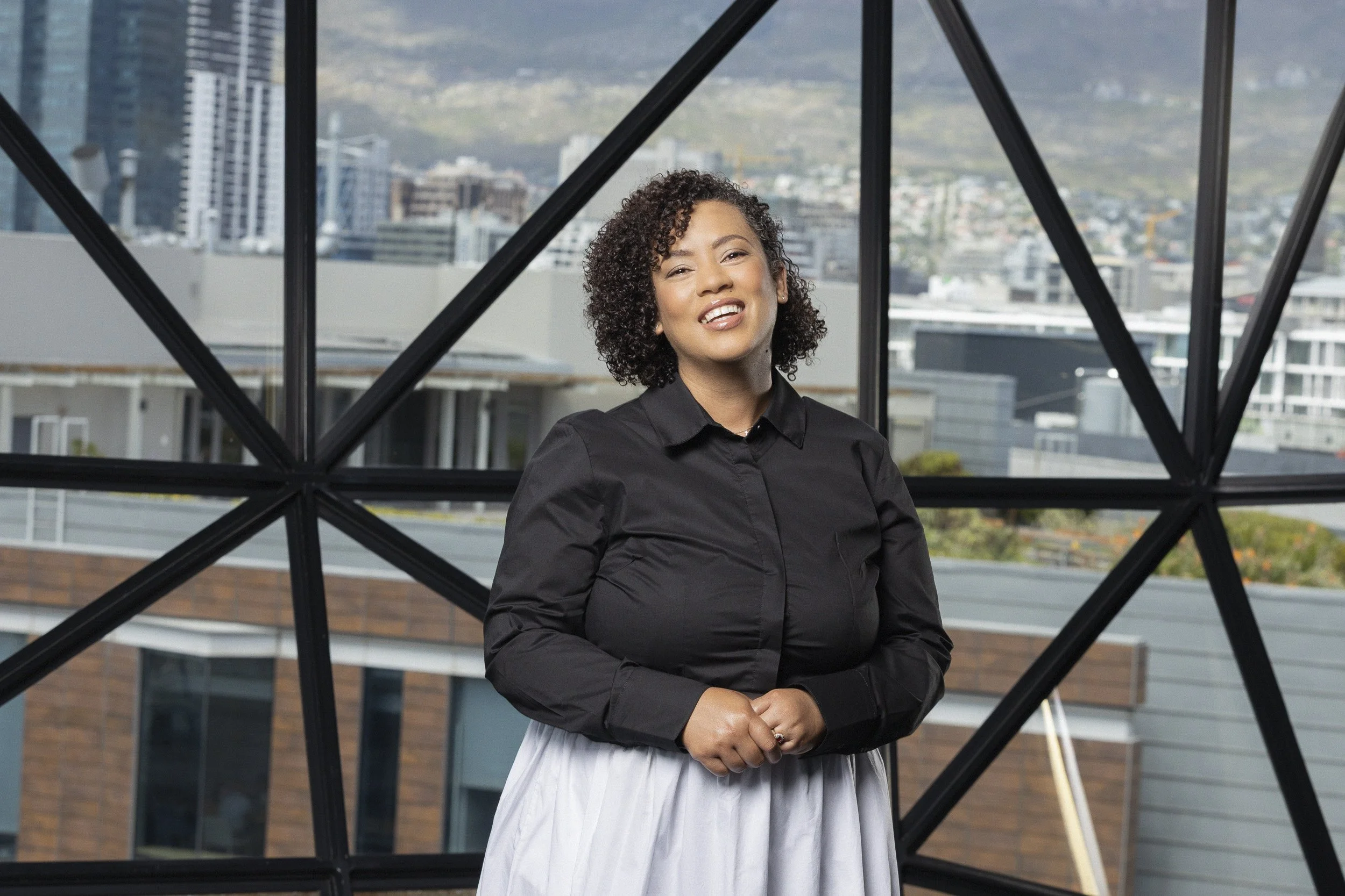 Candice Mckop, Finance and Human Resources Administrator at Zeitz Museum of Contemporary Art Africa (MOCAA), Cape Town South Africa. . Headshot. Makeup:  Laura Mitchell Makeup. Lighting Assistant: Chriss Beukes, Photographer: Lauren Theunissen.   
