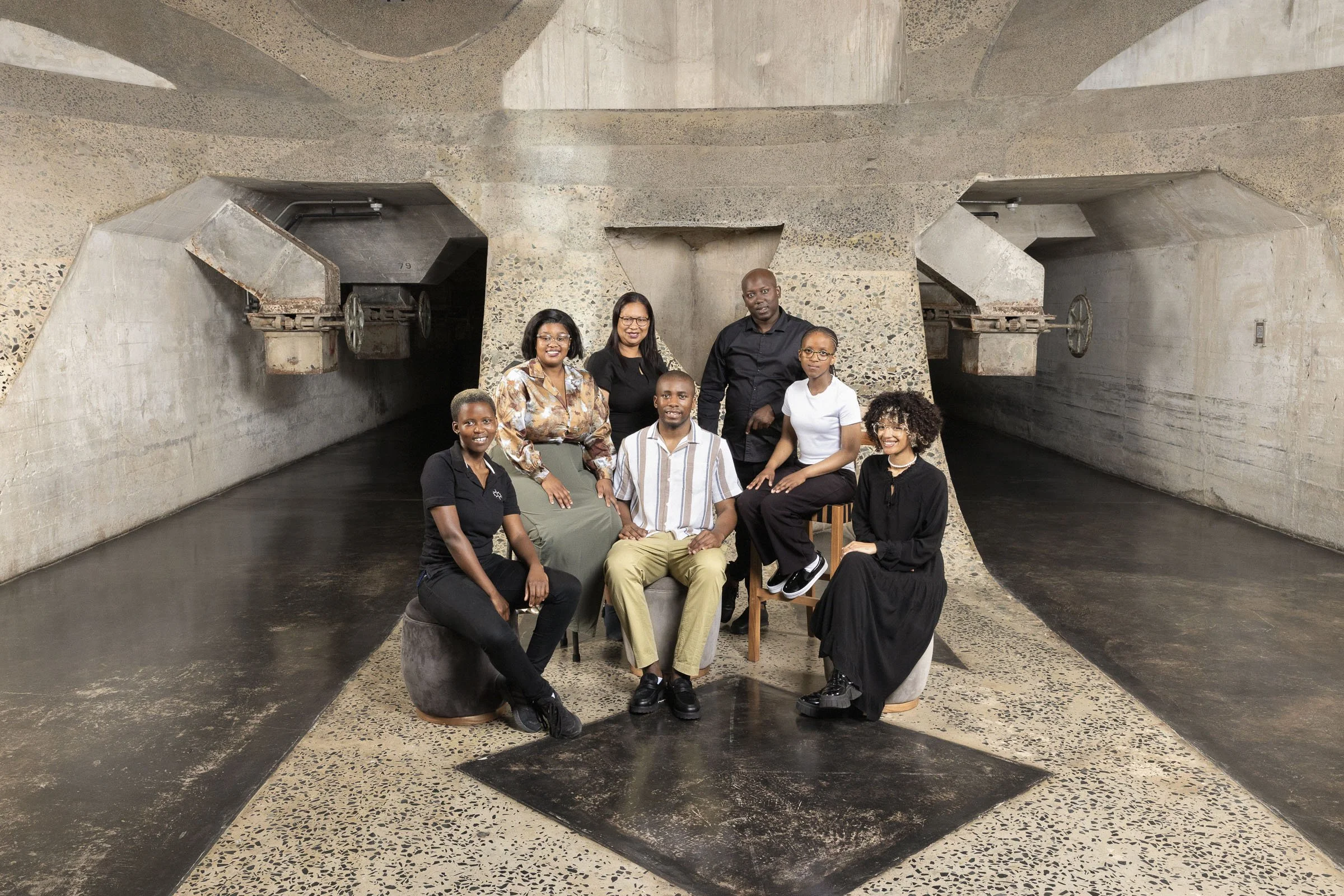 Zeitz MOCAA Shop and Retail Team, Zeitz Museum of Contemporary Art Africa (MOCAA), Cape Town South Africa. . Headshot. Makeup:  Laura Mitchell Makeup. Lighting Assistant: Chriss Beukes, Photographer: Lauren Theunissen.  