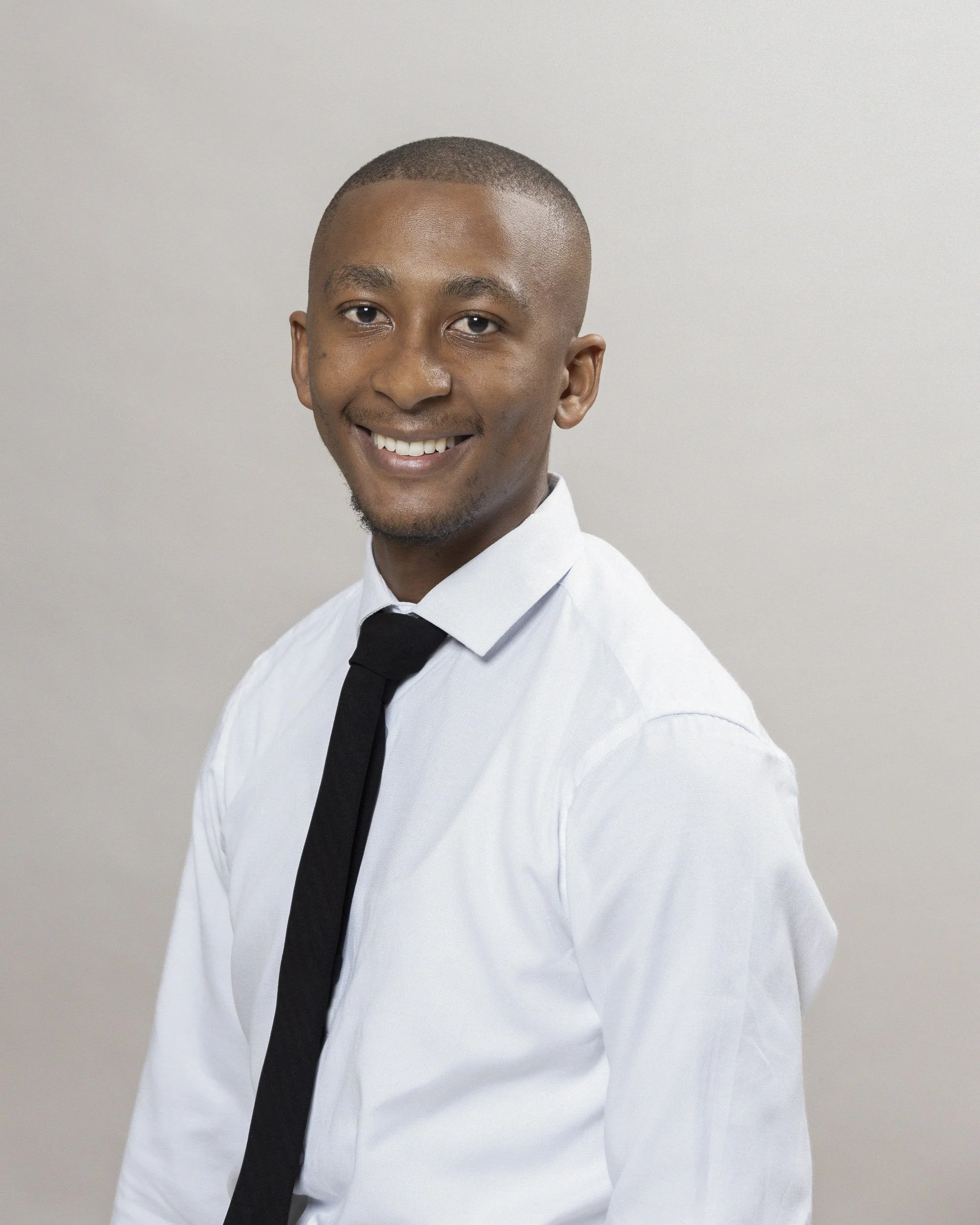 Njabulo, ICWP Liberty, Trusted Financial Advisor, Headshot Photograph done on Location with a portable studio setup at the Liberty offices in Canal Walk by Professional Headshot Portrait by photographer, Lauren Theunissen at Select Image Photographic