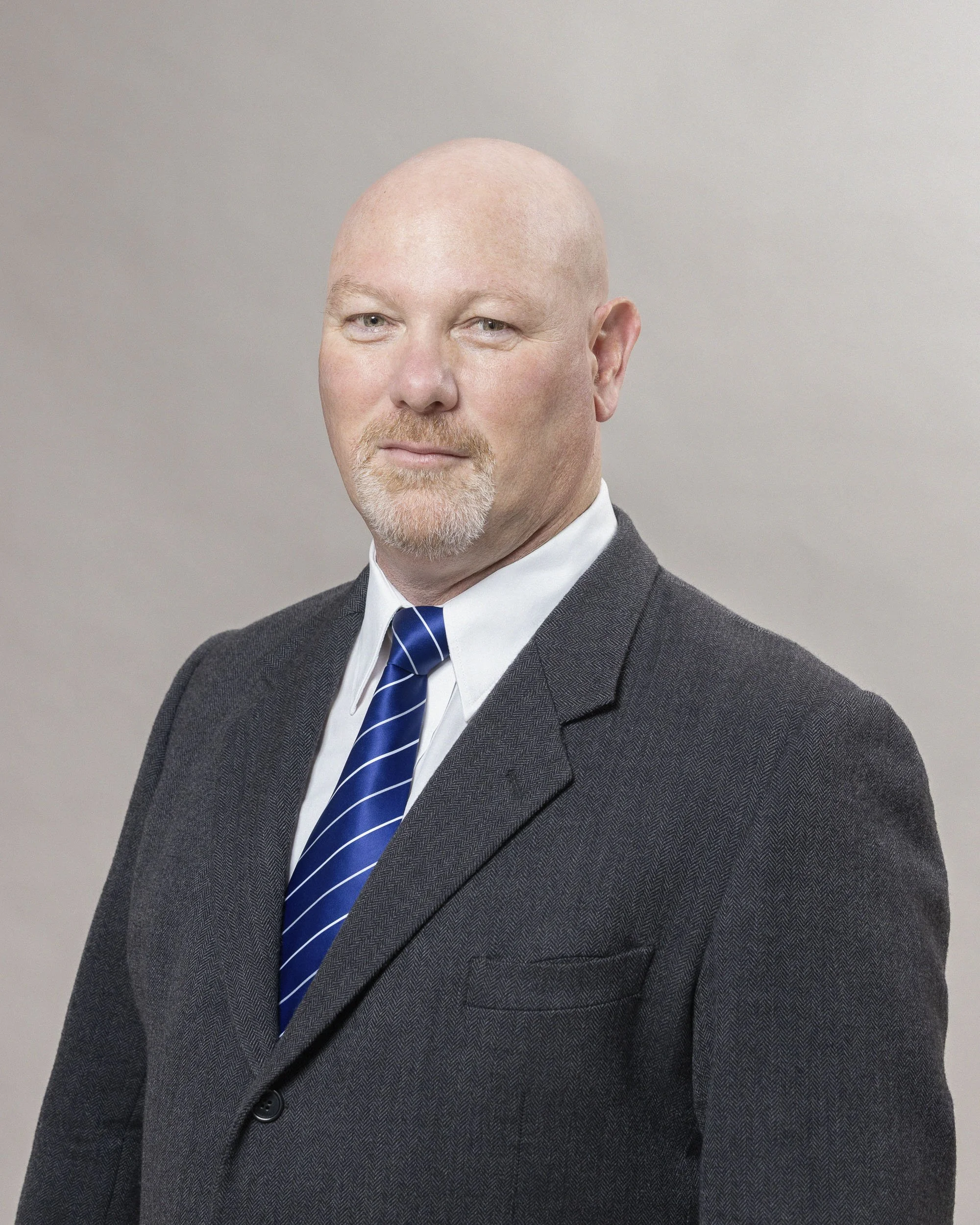 Dion, ICWP Liberty, Trusted Financial Advisor, Headshot Photograph done on Location with a portable studio setup at the Liberty offices in Canal Walk by Professional Headshot Portrait by photographer, Lauren Theunissen at Select Image Photographic se