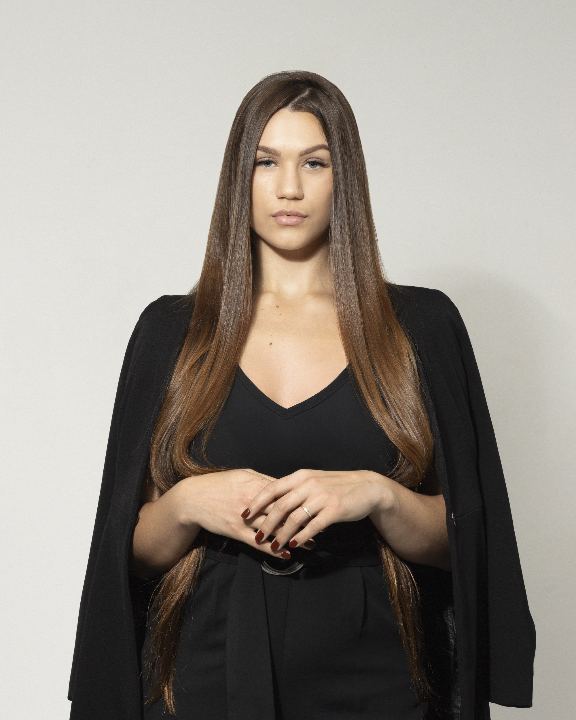 Lea Bosch, luxury real estate agent for Veliciae, Cape Town, South Africa. Professional Studio Headshot. all black outfit styling. 