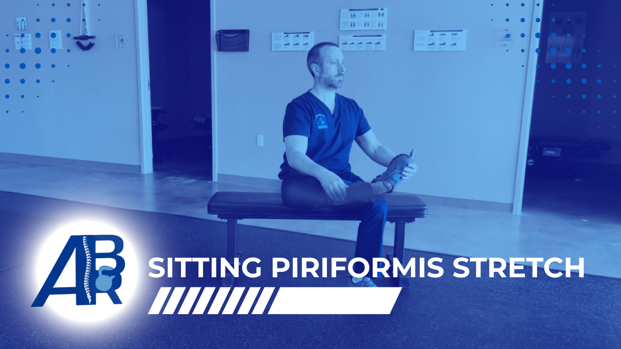 A man sitting on a bench holding his foot in a stretching exercise in a physical therapy office with a logo and text "Sitting Piriformis Stretch" in the foreground.