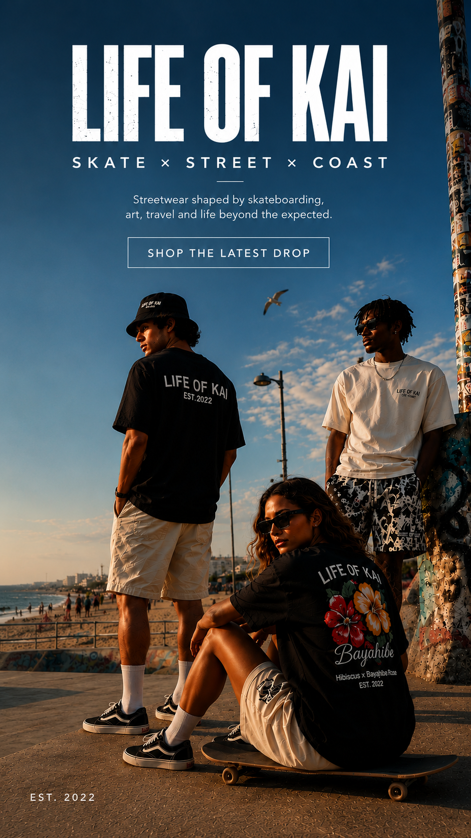 Four young people at a beach during sunset, wearing streetwear with 'Life of Kai' branding, with a seagull flying overhead, a pole covered in stickers, and city buildings in the background.