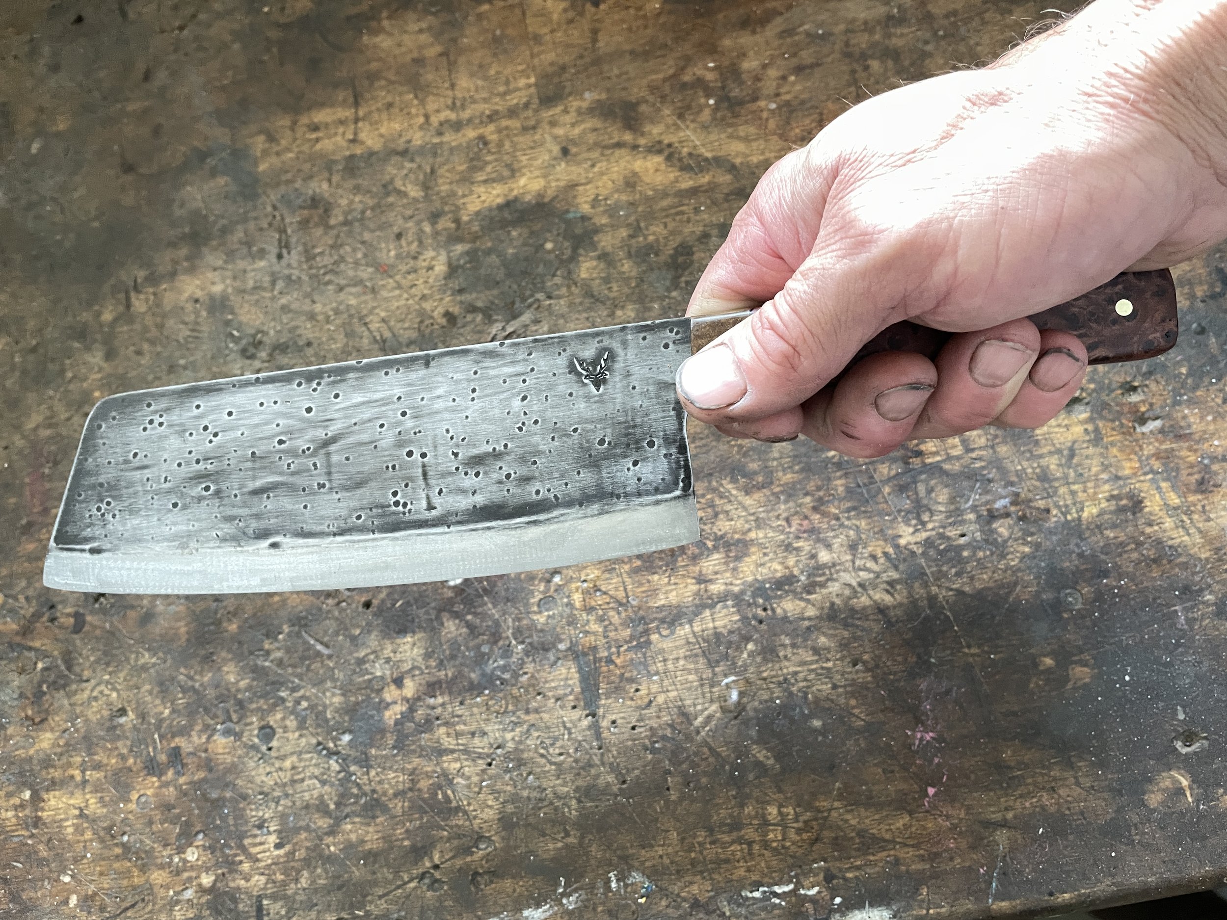 Totara Burl Cleaver shown in the hand