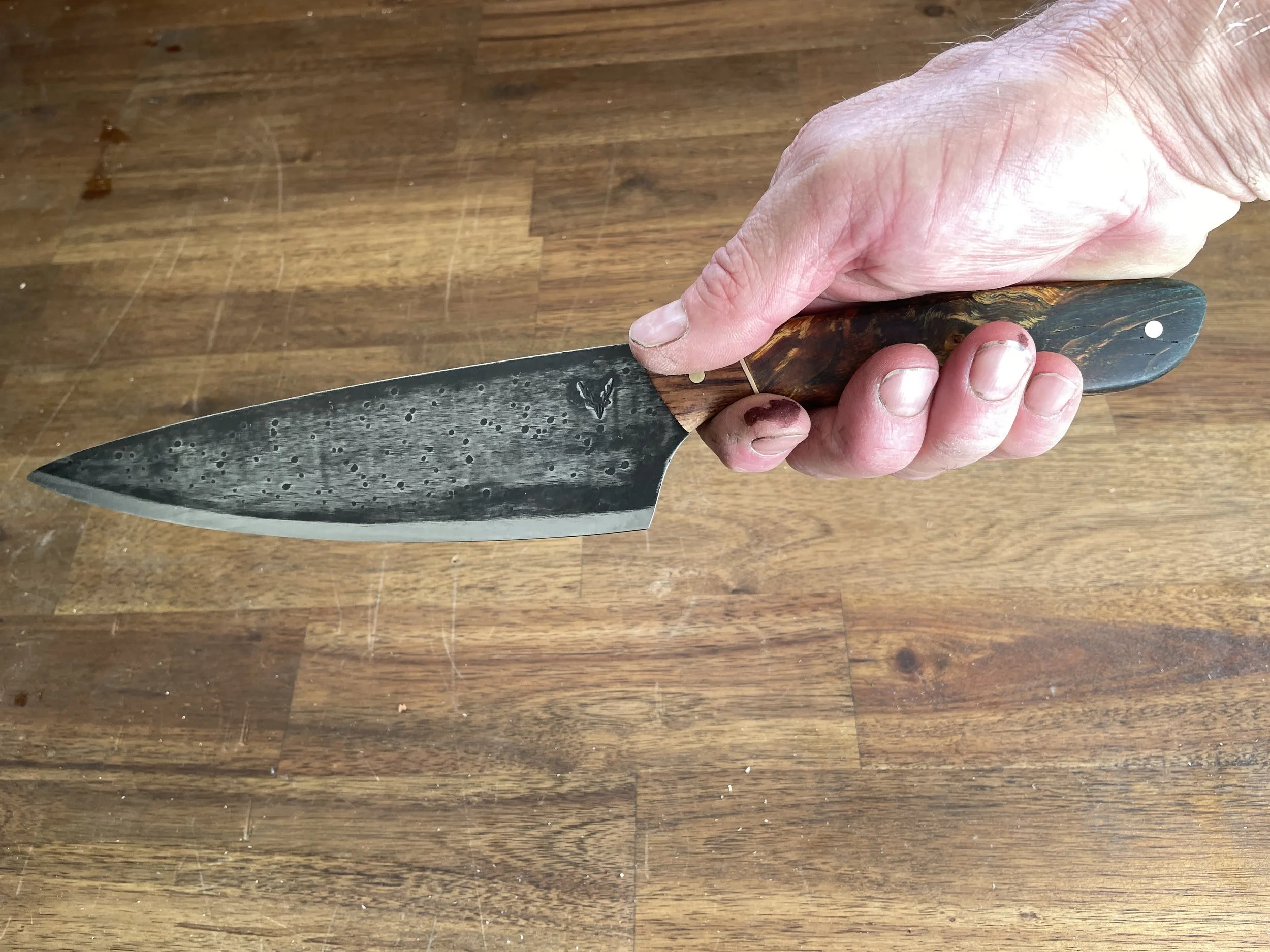 Curly Birch Chef Knife in hand