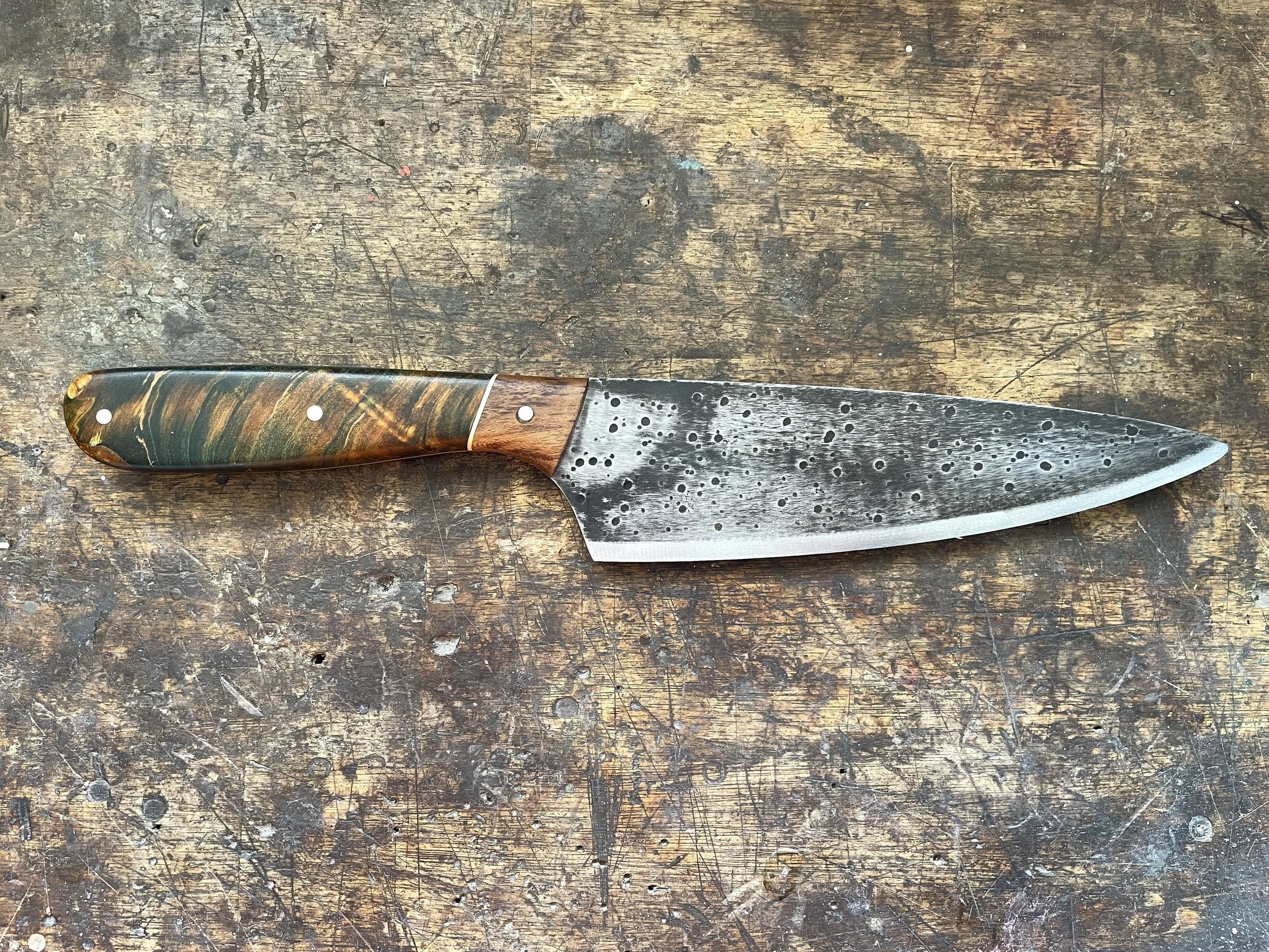 7 inch curly birch knife facing right