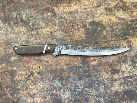 High carbon filleting knife facing right