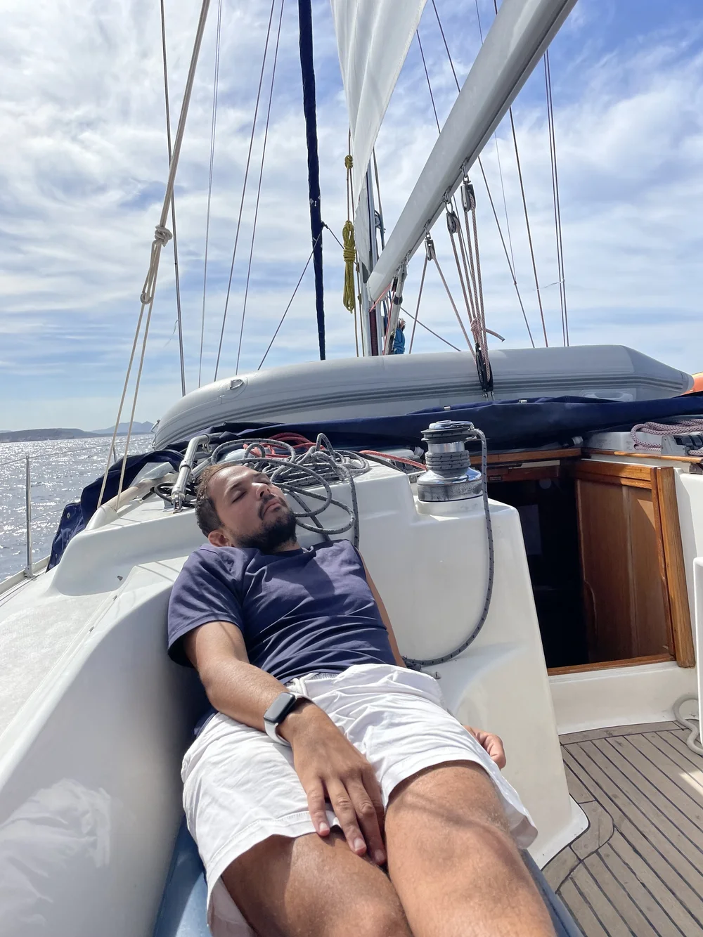 Justin sleeping while sailing.jpeg
