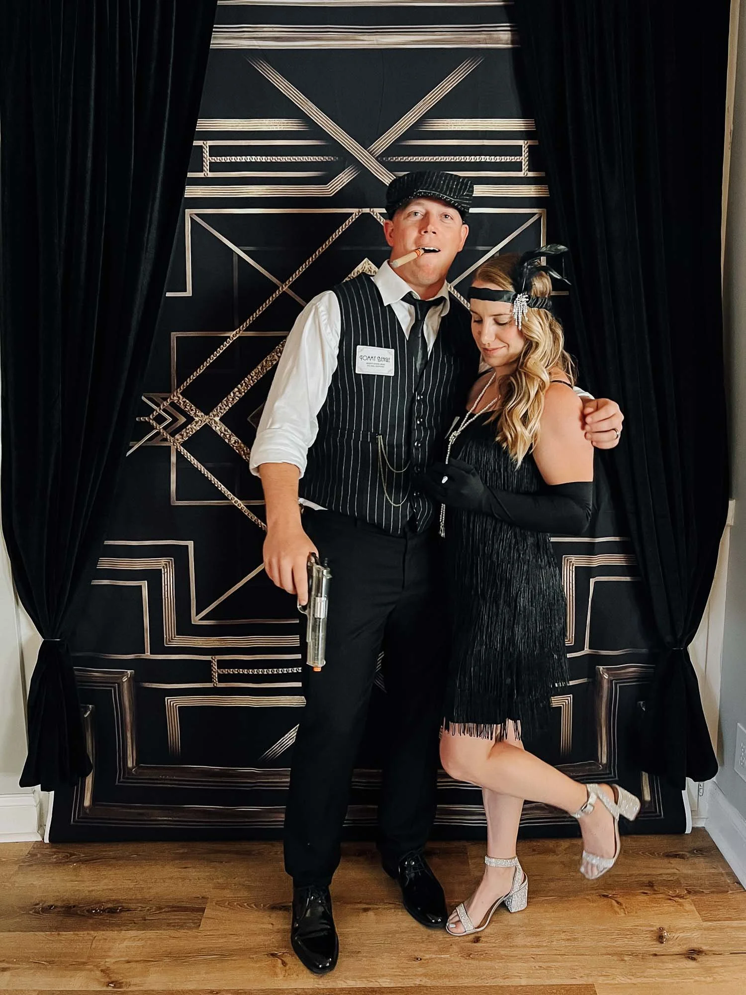 1920's theme murder mystery party couple costumes with gangster and flapper girl