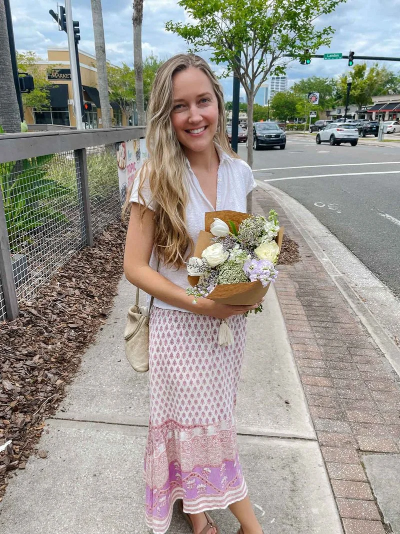 Hannah London holding bouquet outside of Got Flowers Jax in Jacksonville